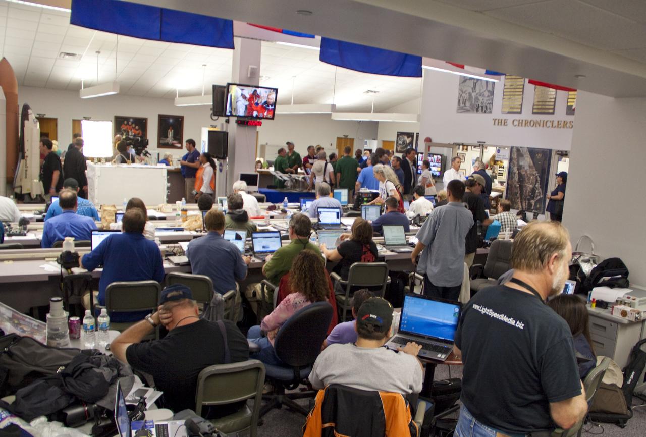 CAPE CANAVERAL, Fla. -- Media and Tweetup participants from around the globe gather at the NASA News Center at NASA Kennedy Space Center's Press Site in Florida to cover the prelaunch activities and lift off of space shuttle Atlantis on its STS-135 mission to the International Space Station.               Atlantis began its final flight, with Commander Chris Ferguson, Pilot Doug Hurley and Mission Specialists Sandy Magnus and Rex Walheim on board, at 11:29 a.m. EDT July 8 to deliver the Raffaello multi-purpose logistics module packed with supplies and spare parts to the station. Also in Atlantis' payload bay is the Robotic Refueling Mission experiment that will investigate the potential for robotically refueling existing satellites in orbit. In addition, Atlantis will return with a failed ammonia pump module to help NASA better understand the failure mechanism and improve pump designs for future systems. STS-135 is the 33rd flight of Atlantis, the 37th shuttle mission to the space station, and the 135th and final mission of NASA's Space Shuttle Program. For more information, visit www.nasa.gov/mission_pages/shuttle/shuttlemissions/sts135/index.html. Photo credit: NASA/Jim Grossmann