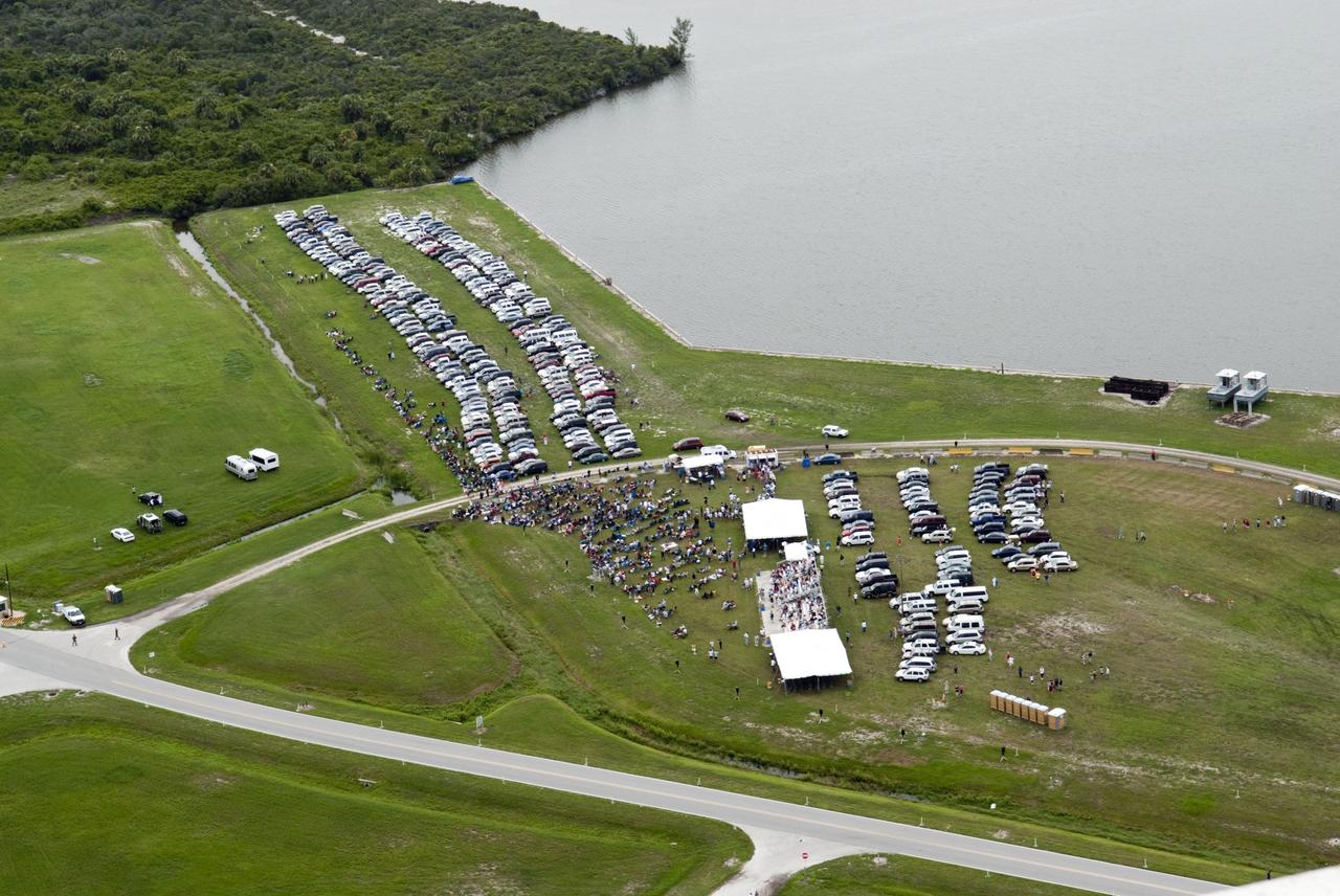 CAPE CANAVERAL, Fla. -- Taken from the Vehicle Assembly Building roof at NASA's Kennedy Space Center in Florida, this image shows the Turn Basin with a myriad of vehicles belonging to invited guests for the launch of space shuttle Atlantis. Atlantis began its final flight, the STS-135 mission to the International Space Station, at 11:29 a.m. EDT on July 8.       STS-135 will deliver the Raffaello multi-purpose logistics module packed with supplies and spare parts for the International Space Station. Atlantis also will fly the Robotic Refueling Mission experiment that will investigate the potential for robotically refueling existing satellites in orbit. In addition, Atlantis will return with a failed ammonia pump module to help NASA better understand the failure mechanism and improve pump designs for future systems. STS-135 will be the 33rd flight of Atlantis, the 37th shuttle mission to the space station, and the 135th and final mission of NASA's Space Shuttle Program. For more information, visit www.nasa.gov/mission_pages/shuttle/shuttlemissions/sts135/index.html. Photo credit: NASA/Jeffrey Marino
