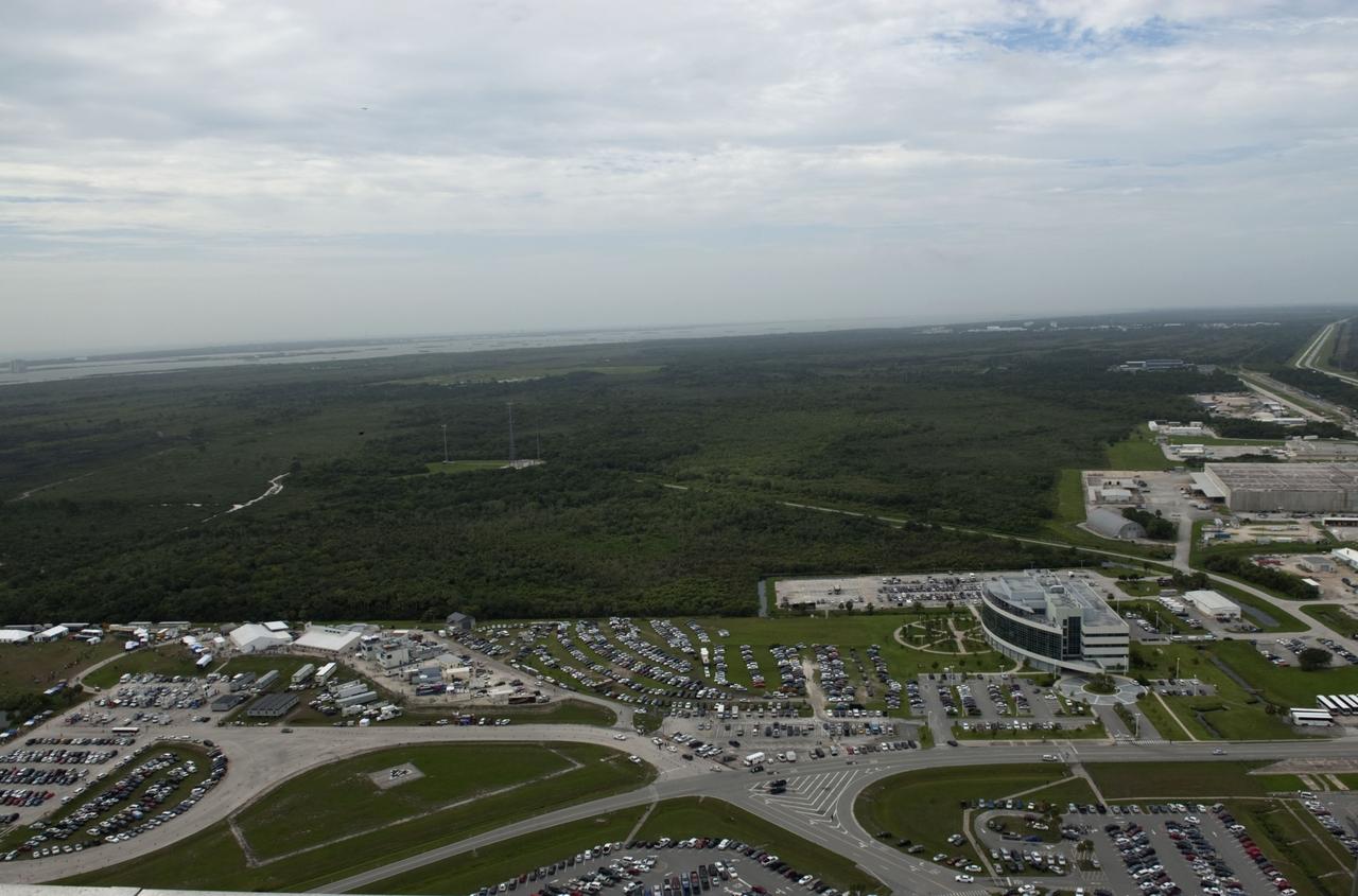 CAPE CANAVERAL, Fla. -- Taken from the Vehicle Assembly Building roof at NASA's Kennedy Space Center in Florida, this image shows the Launch Complex 39 area with a myriad of vehicles, satellite trucks and trailers belonging to invited guests and media for the launch of space shuttle Atlantis. Atlantis began its final flight, the STS-135 mission to the International Space Station, at 11:29 a.m. EDT on July 8.       STS-135 will deliver the Raffaello multi-purpose logistics module packed with supplies and spare parts for the International Space Station. Atlantis also will fly the Robotic Refueling Mission experiment that will investigate the potential for robotically refueling existing satellites in orbit. In addition, Atlantis will return with a failed ammonia pump module to help NASA better understand the failure mechanism and improve pump designs for future systems. STS-135 will be the 33rd flight of Atlantis, the 37th shuttle mission to the space station, and the 135th and final mission of NASA's Space Shuttle Program. For more information, visit www.nasa.gov/mission_pages/shuttle/shuttlemissions/sts135/index.html. Photo credit: NASA/Jeffrey Marino