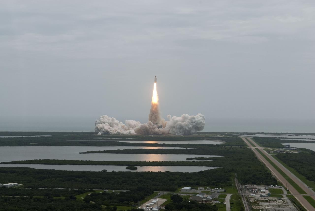 CAPE CANAVERAL, Fla. -- Seen from the roof of the Vehicle Assembly Building, space shuttle Atlantis thunders off Launch Pad 39A at NASA's Kennedy Space Center in Florida. Atlantis began its final flight, the STS-135 mission to the International Space Station, at 11:29 a.m. EDT on July 8.      STS-135 will deliver the Raffaello multi-purpose logistics module packed with supplies and spare parts for the International Space Station. Atlantis also will fly the Robotic Refueling Mission experiment that will investigate the potential for robotically refueling existing satellites in orbit. In addition, Atlantis will return with a failed ammonia pump module to help NASA better understand the failure mechanism and improve pump designs for future systems. STS-135 will be the 33rd flight of Atlantis, the 37th shuttle mission to the space station, and the 135th and final mission of NASA's Space Shuttle Program. For more information, visit www.nasa.gov/mission_pages/shuttle/shuttlemissions/sts135/index.html. Photo credit: NASA/Jeffrey Marino