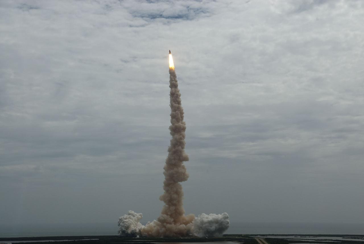 CAPE CANAVERAL, Fla. -- Seen from the roof of the Vehicle Assembly Building, space shuttle Atlantis thunders off Launch Pad 39A at NASA's Kennedy Space Center in Florida. Atlantis began its final flight, the STS-135 mission to the International Space Station, at 11:29 a.m. EDT on July 8.    STS-135 will deliver the Raffaello multi-purpose logistics module packed with supplies and spare parts for the International Space Station. Atlantis also will fly the Robotic Refueling Mission experiment that will investigate the potential for robotically refueling existing satellites in orbit. In addition, Atlantis will return with a failed ammonia pump module to help NASA better understand the failure mechanism and improve pump designs for future systems. STS-135 will be the 33rd flight of Atlantis, the 37th shuttle mission to the space station, and the 135th and final mission of NASA's Space Shuttle Program. For more information, visit www.nasa.gov/mission_pages/shuttle/shuttlemissions/sts135/index.html. Photo credit: NASA/Jeffrey Marino