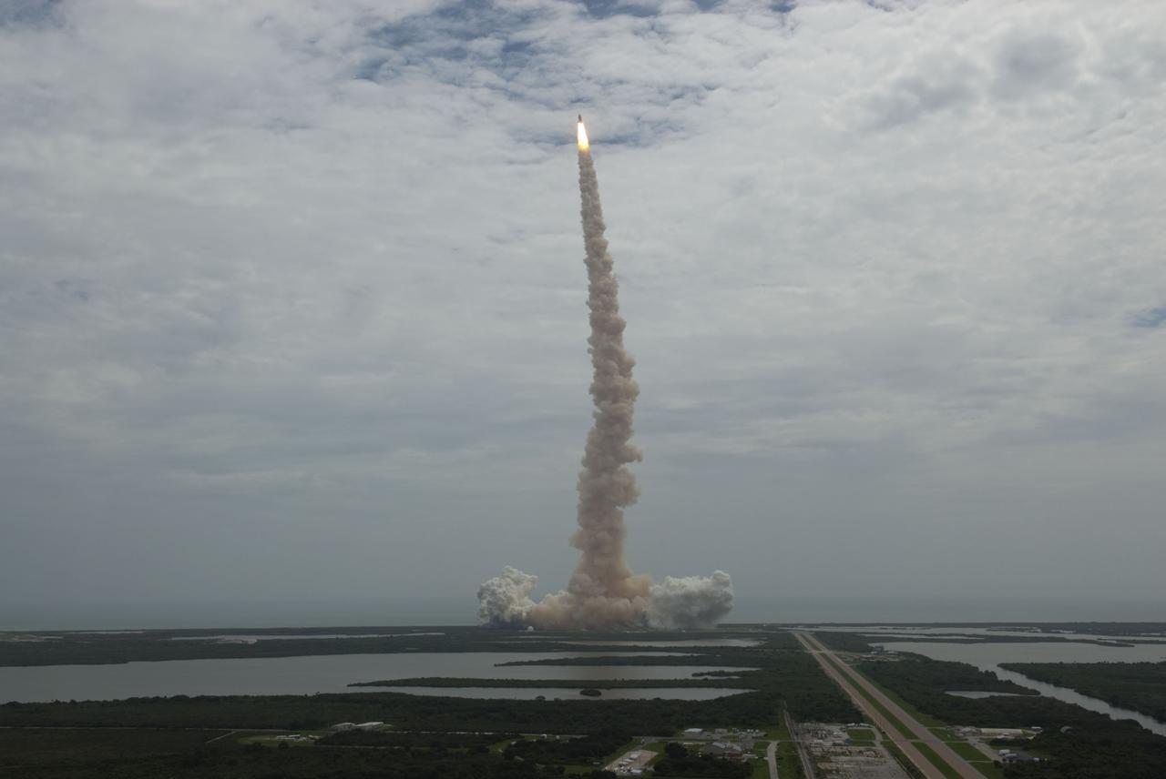 CAPE CANAVERAL, Fla. -- Seen from the roof of the Vehicle Assembly Building, space shuttle Atlantis thunders off Launch Pad 39A at NASA's Kennedy Space Center in Florida. Atlantis began its final flight, the STS-135 mission to the International Space Station, at 11:29 a.m. EDT on July 8.     STS-135 will deliver the Raffaello multi-purpose logistics module packed with supplies and spare parts for the International Space Station. Atlantis also will fly the Robotic Refueling Mission experiment that will investigate the potential for robotically refueling existing satellites in orbit. In addition, Atlantis will return with a failed ammonia pump module to help NASA better understand the failure mechanism and improve pump designs for future systems. STS-135 will be the 33rd flight of Atlantis, the 37th shuttle mission to the space station, and the 135th and final mission of NASA's Space Shuttle Program. For more information, visit www.nasa.gov/mission_pages/shuttle/shuttlemissions/sts135/index.html. Photo credit: NASA/Jeffrey Marino