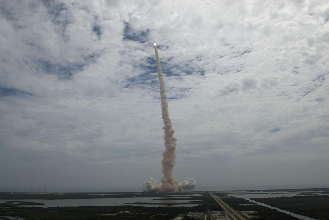 CAPE CANAVERAL, Fla. -- Seen from the roof of the Vehicle Assembly Building, space shuttle Atlantis thunders off Launch Pad 39A at NASA's Kennedy Space Center in Florida. Atlantis began its final flight, the STS-135 mission to the International Space Station, at 11:29 a.m. EDT on July 8.     STS-135 will deliver the Raffaello multi-purpose logistics module packed with supplies and spare parts for the International Space Station. Atlantis also will fly the Robotic Refueling Mission experiment that will investigate the potential for robotically refueling existing satellites in orbit. In addition, Atlantis will return with a failed ammonia pump module to help NASA better understand the failure mechanism and improve pump designs for future systems. STS-135 will be the 33rd flight of Atlantis, the 37th shuttle mission to the space station, and the 135th and final mission of NASA's Space Shuttle Program. For more information, visit www.nasa.gov/mission_pages/shuttle/shuttlemissions/sts135/index.html. Photo credit: NASA/Jeffrey Marino