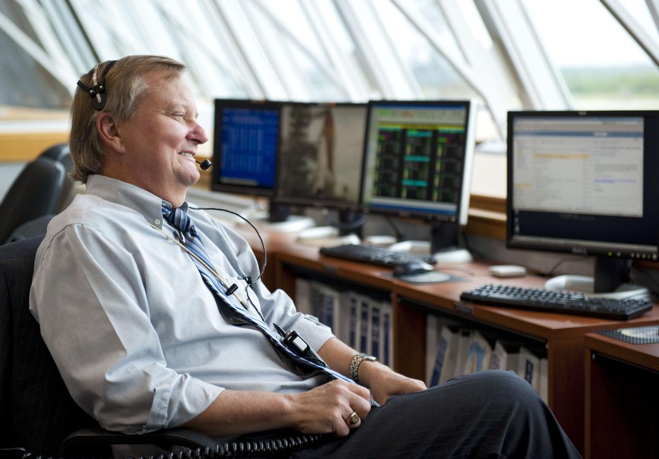 CAPE CANAVERAL, Fla. -- Shuttle Launch Director Mike Leinbach, enjoys a light moment during the countdown to liftoff of space shuttle Atlantis to the International Space Station in Firing Room 4 of the Launch Control Center at NASA's Kennedy Space Center in Florida.                Atlantis with its crew of four; Commander Chris Ferguson, Pilot Doug Hurley, Mission Specialists Sandy Magnus and Rex Walheim, lifted off at 11:29 a.m. EDT on July 8, 2011 to deliver the Raffaello multi-purpose logistics module packed with supplies and spare parts for the station. Atlantis also will fly the Robotic Refueling Mission experiment that will investigate the potential for robotically refueling existing satellites in orbit. In addition, Atlantis will return with a failed ammonia pump module to help NASA better understand the failure mechanism and improve pump designs for future systems. STS-135 will be the 33rd flight of Atlantis, the 37th shuttle mission to the space station, and the 135th and final mission of NASA's Space Shuttle Program. For more information, visit www.nasa.gov/mission_pages/shuttle/shuttlemissions/sts135/index.html. Photo credit: NASA/Kim Shiflett