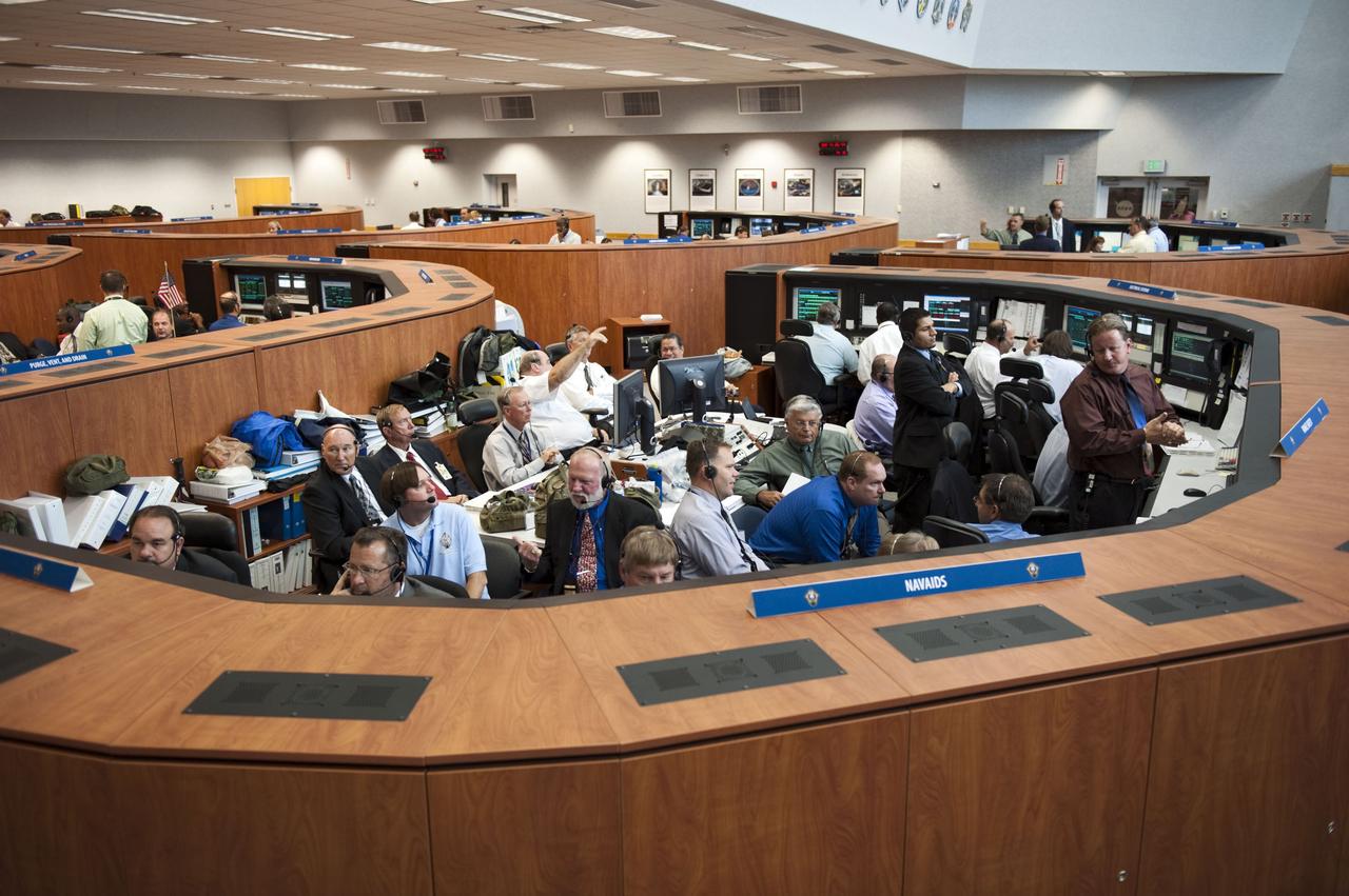 CAPE CANAVERAL, Fla. -- In Firing Room 4 of the Launch Control Center at NASA's Kennedy Space Center in Florida, launch team members monitor the countdown to the launch of space shuttle Atlantis on its STS-135 mission to the International Space Station.              Atlantis with its crew of four; Commander Chris Ferguson, Pilot Doug Hurley, Mission Specialists Sandy Magnus and Rex Walheim, lifted off at 11:29 a.m. EDT on July 8, 2011 to deliver the Raffaello multi-purpose logistics module packed with supplies and spare parts for the station. Atlantis also will fly the Robotic Refueling Mission experiment that will investigate the potential for robotically refueling existing satellites in orbit. In addition, Atlantis will return with a failed ammonia pump module to help NASA better understand the failure mechanism and improve pump designs for future systems. STS-135 will be the 33rd flight of Atlantis, the 37th shuttle mission to the space station, and the 135th and final mission of NASA's Space Shuttle Program. For more information, visit www.nasa.gov/mission_pages/shuttle/shuttlemissions/sts135/index.html. Photo credit: NASA/Kim Shiflett