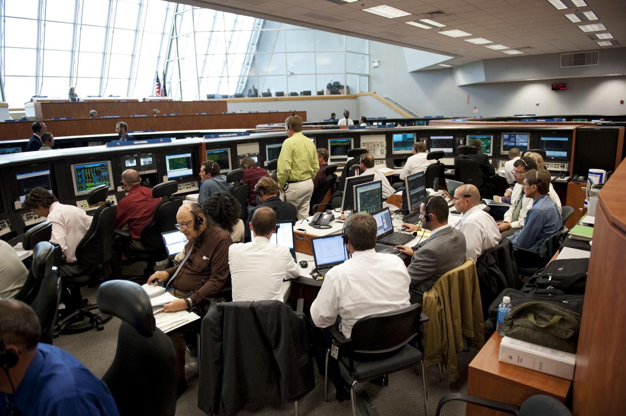 CAPE CANAVERAL, Fla. -- In Firing Room 4 of the Launch Control Center at NASA's Kennedy Space Center in Florida, launch team members monitor the countdown to the launch of space shuttle Atlantis on its STS-135 mission to the International Space Station.              Atlantis with its crew of four; Commander Chris Ferguson, Pilot Doug Hurley, Mission Specialists Sandy Magnus and Rex Walheim, lifted off at 11:29 a.m. EDT on July 8, 2011 to deliver the Raffaello multi-purpose logistics module packed with supplies and spare parts for the station. Atlantis also will fly the Robotic Refueling Mission experiment that will investigate the potential for robotically refueling existing satellites in orbit. In addition, Atlantis will return with a failed ammonia pump module to help NASA better understand the failure mechanism and improve pump designs for future systems. STS-135 will be the 33rd flight of Atlantis, the 37th shuttle mission to the space station, and the 135th and final mission of NASA's Space Shuttle Program. For more information, visit www.nasa.gov/mission_pages/shuttle/shuttlemissions/sts135/index.html. Photo credit: NASA/Kim Shiflett