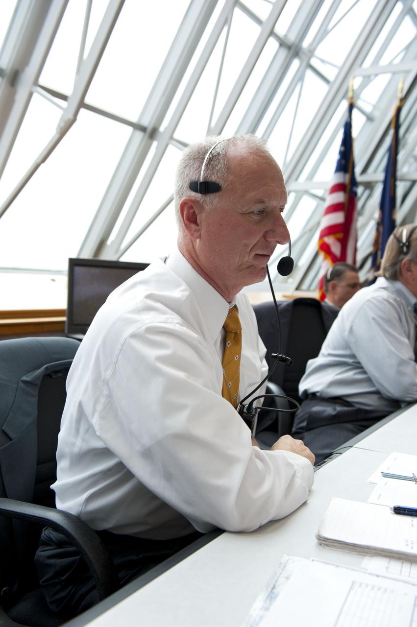 CAPE CANAVERAL, Fla. -- In Firing Room 4 of the Launch Control Center at NASA's Kennedy Space Center in Florida, launch team members monitor the countdown to the launch of space shuttle Atlantis on its STS-135 mission to the International Space Station. Seen here is Assistant Launch Director Pete Nickolenko.          Atlantis with its crew of four; Commander Chris Ferguson, Pilot Doug Hurley, Mission Specialists Sandy Magnus and Rex Walheim, lifted off at 11:29 a.m. EDT on July 8, 2011 to deliver the Raffaello multi-purpose logistics module packed with supplies and spare parts for the station. Atlantis also will fly the Robotic Refueling Mission experiment that will investigate the potential for robotically refueling existing satellites in orbit. In addition, Atlantis will return with a failed ammonia pump module to help NASA better understand the failure mechanism and improve pump designs for future systems. STS-135 will be the 33rd flight of Atlantis, the 37th shuttle mission to the space station, and the 135th and final mission of NASA's Space Shuttle Program. For more information, visit www.nasa.gov/mission_pages/shuttle/shuttlemissions/sts135/index.html. Photo credit: NASA/Kim Shiflett