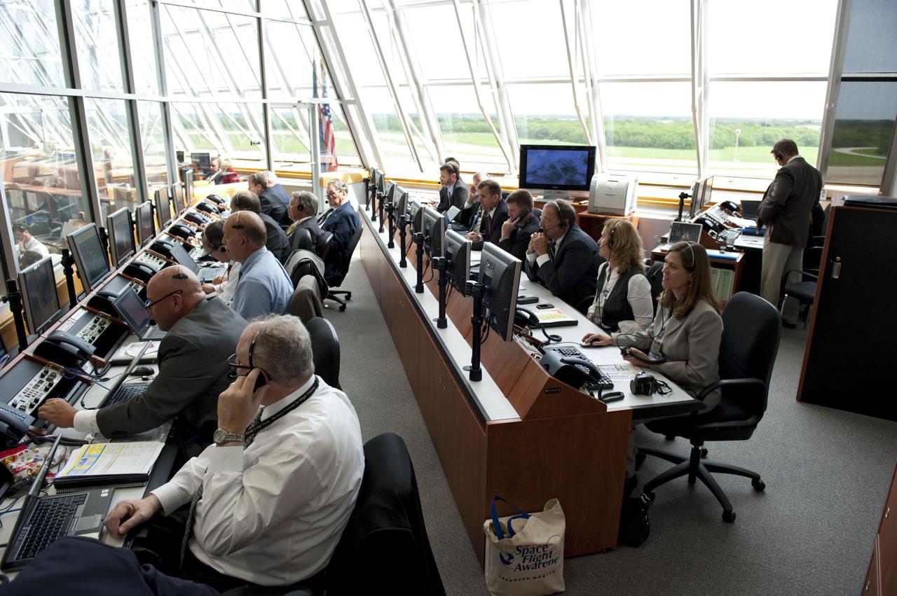 CAPE CANAVERAL, Fla. -- In Firing Room 4 of the Launch Control Center at NASA's Kennedy Space Center in Florida, launch team members monitor the countdown to the launch of space shuttle Atlantis on its STS-135 mission to the International Space Station.        Atlantis with its crew of four; Commander Chris Ferguson, Pilot Doug Hurley, Mission Specialists Sandy Magnus and Rex Walheim, lifted off at 11:29 a.m. EDT on July 8, 2011 to deliver the Raffaello multi-purpose logistics module packed with supplies and spare parts for the station. Atlantis also will fly the Robotic Refueling Mission experiment that will investigate the potential for robotically refueling existing satellites in orbit. In addition, Atlantis will return with a failed ammonia pump module to help NASA better understand the failure mechanism and improve pump designs for future systems. STS-135 will be the 33rd flight of Atlantis, the 37th shuttle mission to the space station, and the 135th and final mission of NASA's Space Shuttle Program. For more information, visit www.nasa.gov/mission_pages/shuttle/shuttlemissions/sts135/index.html. Photo credit: NASA/Kim Shiflett