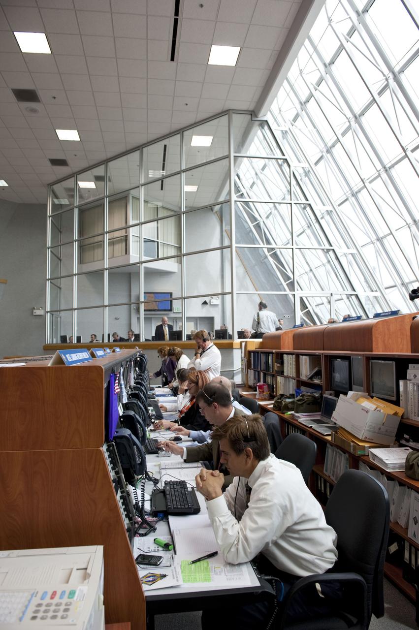 CAPE CANAVERAL, Fla. -- In Firing Room 4 of the Launch Control Center at NASA's Kennedy Space Center in Florida, launch team members monitor the countdown to the launch of space shuttle Atlantis on its STS-135 mission to the International Space Station. Atlantis with its crew of four; Commander Chris Ferguson, Pilot Doug Hurley, Mission Specialists Sandy Magnus and Rex Walheim, lifted off at 11:29 a.m. EDT on July 8, 2011 to deliver the Raffaello multi-purpose logistics module packed with supplies and spare parts for the station. Atlantis also will fly the Robotic Refueling Mission experiment that will investigate the potential for robotically refueling existing satellites in orbit. In addition, Atlantis will return with a failed ammonia pump module to help NASA better understand the failure mechanism and improve pump designs for future systems. STS-135 will be the 33rd flight of Atlantis, the 37th shuttle mission to the space station, and the 135th and final mission of NASA's Space Shuttle Program. For more information, visit www.nasa.gov/mission_pages/shuttle/shuttlemissions/sts135/index.html. Photo credit: NASA/Kim Shiflett