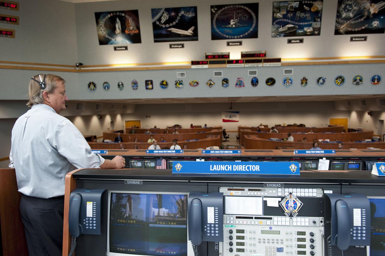 CAPE CANAVERAL, Fla. -- In Firing Room 4 of the Launch Control Center at NASA's Kennedy Space Center in Florida, Shuttle Launch Director Mike Leinbach oversees the countdown to the launch of space shuttle Atlantis on its STS-135 mission to the International Space Station. Atlantis with its crew of four; Commander Chris Ferguson, Pilot Doug Hurley, Mission Specialists Sandy Magnus and Rex Walheim, lifted off at 11:29 a.m. EDT on July 8, 2011 to deliver the Raffaello multi-purpose logistics module packed with supplies and spare parts for the station. Atlantis also will fly the Robotic Refueling Mission experiment that will investigate the potential for robotically refueling existing satellites in orbit. In addition, Atlantis will return with a failed ammonia pump module to help NASA better understand the failure mechanism and improve pump designs for future systems. STS-135 will be the 33rd flight of Atlantis, the 37th shuttle mission to the space station, and the 135th and final mission of NASA's Space Shuttle Program. For more information, visit www.nasa.gov/mission_pages/shuttle/shuttlemissions/sts135/index.html. Photo credit: NASA/Kim Shiflett