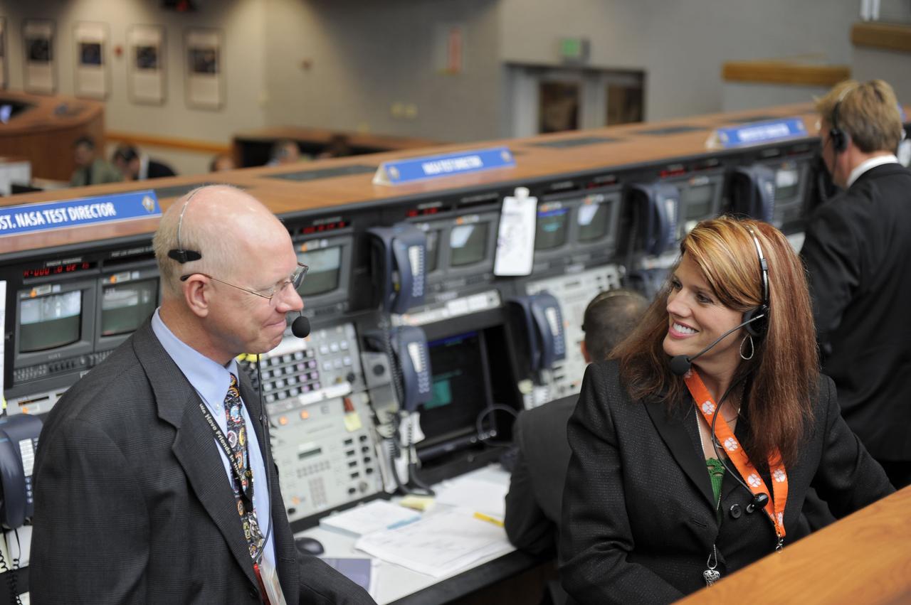CAPE CANAVERAL, Fla. -- In Firing Room 4 of the Launch Control Center at NASA's Kennedy Space Center in Florida, NASA Test Directors Steve Payne and Charlie Blackwell-Thompson smile approvingly after space shuttle Atlantis' successful launch on its STS-135 mission to the International Space Station. Atlantis with its crew of four; Commander Chris Ferguson, Pilot Doug Hurley, Mission Specialists Sandy Magnus and Rex Walheim, lifted off at 11:29 a.m. EDT on July 8, 2011 to deliver the Raffaello multi-purpose logistics module packed with supplies and spare parts for the station. Atlantis also will fly the Robotic Refueling Mission experiment that will investigate the potential for robotically refueling existing satellites in orbit. In addition, Atlantis will return with a failed ammonia pump module to help NASA better understand the failure mechanism and improve pump designs for future systems. STS-135 will be the 33rd flight of Atlantis, the 37th shuttle mission to the space station, and the 135th and final mission of NASA's Space Shuttle Program. For more information, visit www.nasa.gov/mission_pages/shuttle/shuttlemissions/sts135/index.html. Photo credit: NASA/Kim Shiflett