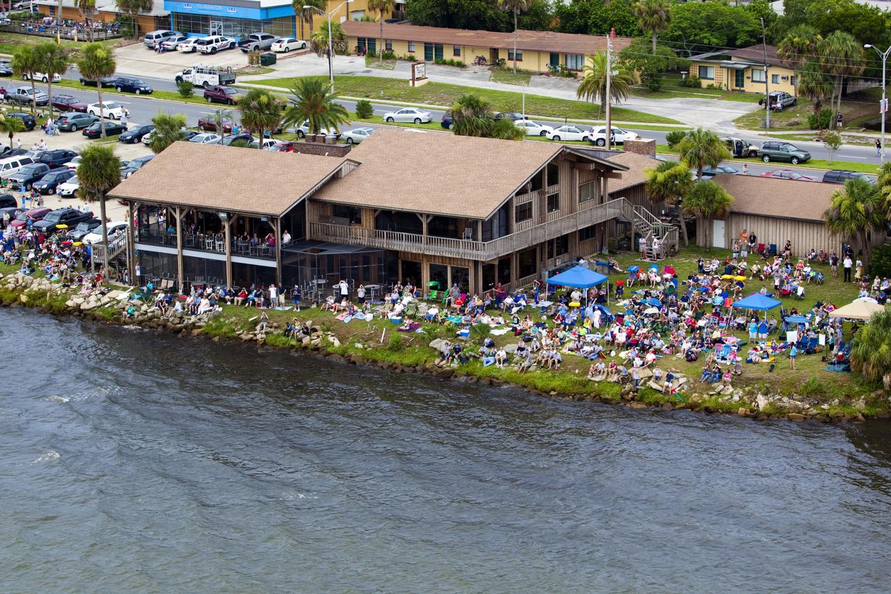 CAPE CANAVERAL, Fla. -- After 30 years and 135 missions, residents and visitors to Florida's Space Coast flock to a viewing site along U.S. 1 in Titusville to see the rocket's red glare of NASA's Space Shuttle Program soar for the last time. Space shuttle Atlantis is scheduled to liftoff at 11:26 a.m. EDT from Launch Pad 39A at NASA's Kennedy Space Center in Florida. On board will be four experienced astronauts -- STS-135 Commander Chris Ferguson, Pilot Doug Hurley, and Mission Specialists Sandy Magnus and Rex Walheim.          STS-135 will deliver the Raffaello multi-purpose logistics module packed with supplies and spare parts for the International Space Station. Atlantis also will fly the Robotic Refueling Mission experiment that will investigate the potential for robotically refueling existing satellites in orbit. In addition, Atlantis will return with a failed ammonia pump module to help NASA better understand the failure mechanism and improve pump designs for future systems. STS-135 will be the 33rd flight of Atlantis, the 37th shuttle mission to the space station, and the 135th and final mission of NASA's Space Shuttle Program. For more information visit, www.nasa.gov/mission_pages/shuttle/shuttlemissions/sts135/index.html. Photo credit: NASA/Frank Michaux