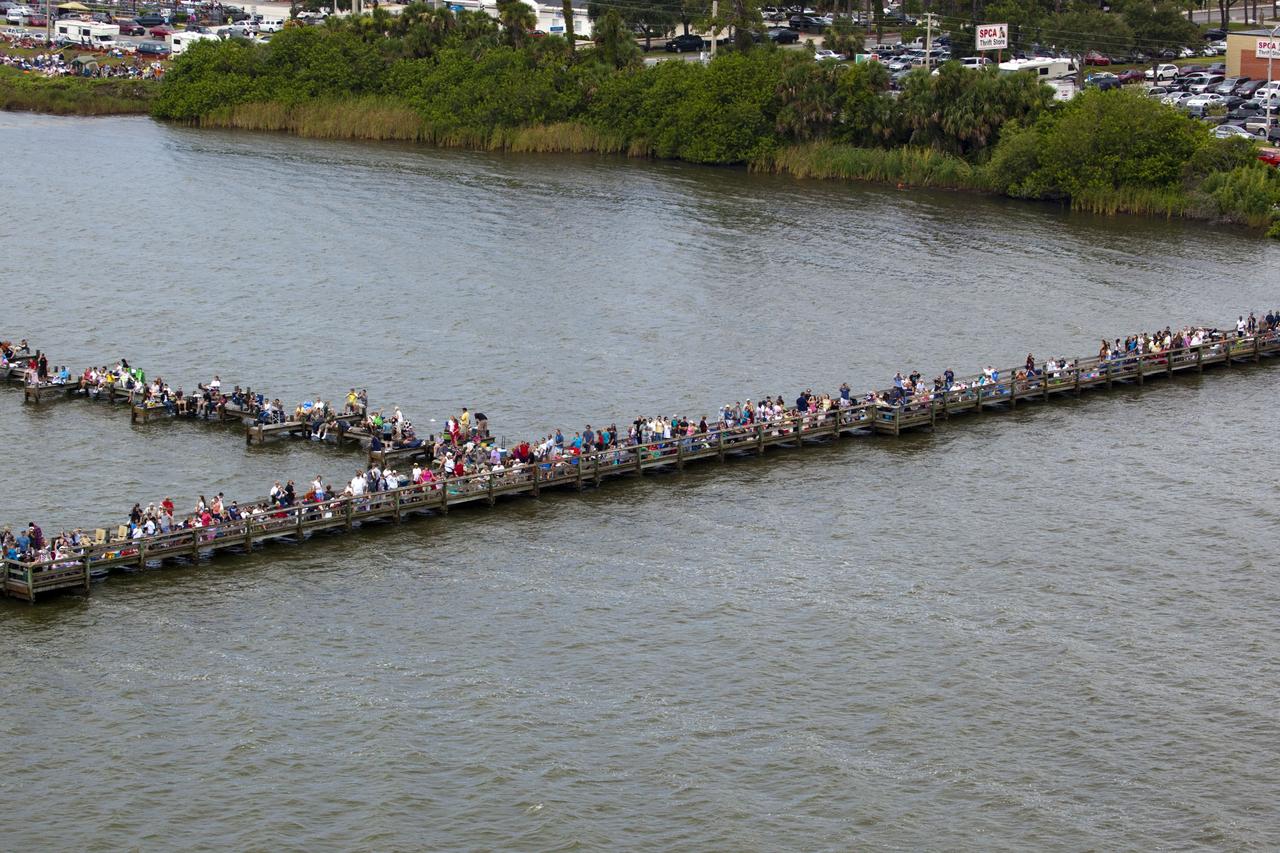 CAPE CANAVERAL, Fla. -- After 30 years and 135 missions, residents and visitors to Florida's Space Coast flock to a viewing site along U.S. 1 in Titusville to see the rocket's red glare of NASA's Space Shuttle Program soar for the last time. Space shuttle Atlantis is scheduled to liftoff at 11:26 a.m. EDT from Launch Pad 39A at NASA's Kennedy Space Center in Florida. On board will be four experienced astronauts -- STS-135 Commander Chris Ferguson, Pilot Doug Hurley, and Mission Specialists Sandy Magnus and Rex Walheim.        STS-135 will deliver the Raffaello multi-purpose logistics module packed with supplies and spare parts for the International Space Station. Atlantis also will fly the Robotic Refueling Mission experiment that will investigate the potential for robotically refueling existing satellites in orbit. In addition, Atlantis will return with a failed ammonia pump module to help NASA better understand the failure mechanism and improve pump designs for future systems. STS-135 will be the 33rd flight of Atlantis, the 37th shuttle mission to the space station, and the 135th and final mission of NASA's Space Shuttle Program. For more information visit, www.nasa.gov/mission_pages/shuttle/shuttlemissions/sts135/index.html. Photo credit: NASA/Frank Michaux