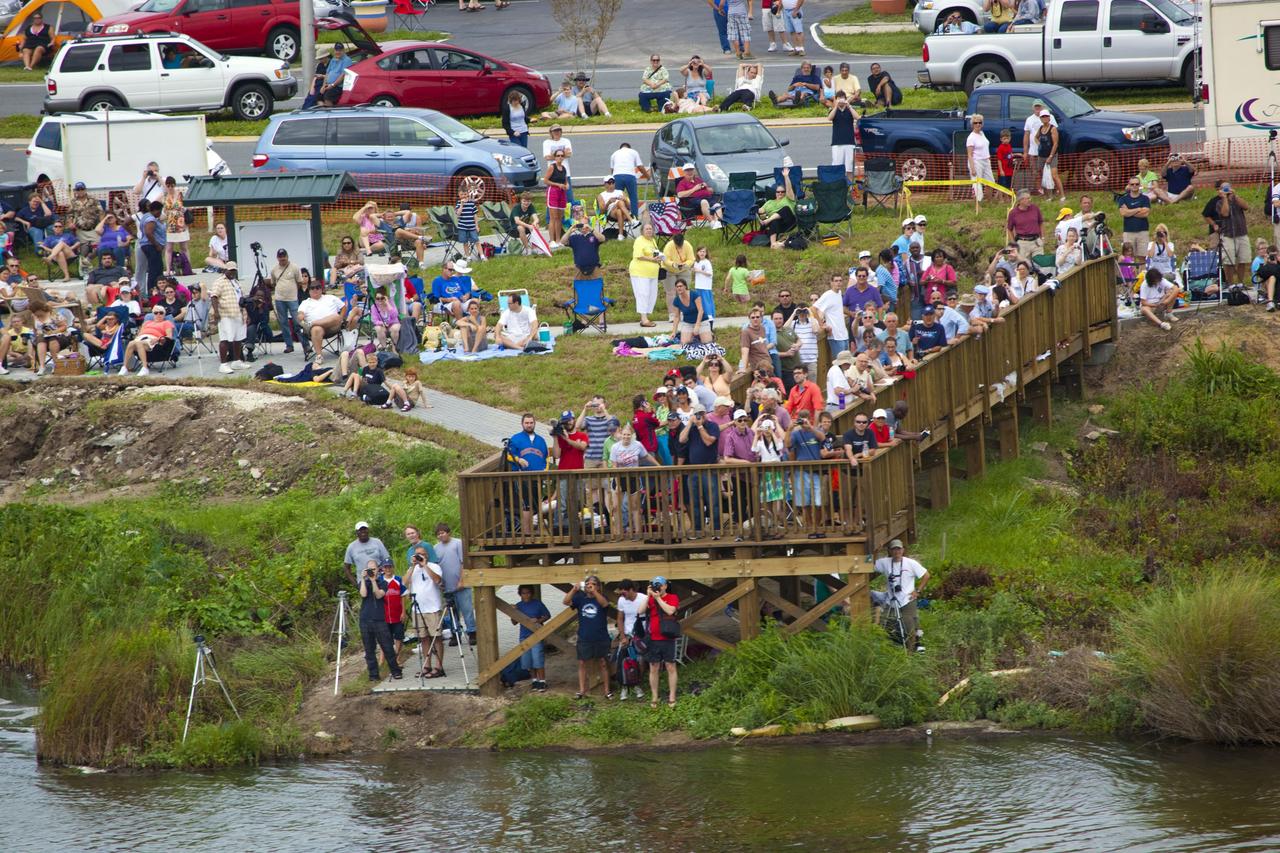 CAPE CANAVERAL, Fla. -- After 30 years and 135 missions, residents and visitors to Florida's Space Coast flock to a viewing site along U.S. 1 in Titusville to see the rocket's red glare of NASA's Space Shuttle Program soar for the last time. Space shuttle Atlantis is scheduled to liftoff at 11:26 a.m. EDT from Launch Pad 39A at NASA's Kennedy Space Center in Florida. On board will be four experienced astronauts -- STS-135 Commander Chris Ferguson, Pilot Doug Hurley, and Mission Specialists Sandy Magnus and Rex Walheim.      STS-135 will deliver the Raffaello multi-purpose logistics module packed with supplies and spare parts for the International Space Station. Atlantis also will fly the Robotic Refueling Mission experiment that will investigate the potential for robotically refueling existing satellites in orbit. In addition, Atlantis will return with a failed ammonia pump module to help NASA better understand the failure mechanism and improve pump designs for future systems. STS-135 will be the 33rd flight of Atlantis, the 37th shuttle mission to the space station, and the 135th and final mission of NASA's Space Shuttle Program. For more information visit, www.nasa.gov/mission_pages/shuttle/shuttlemissions/sts135/index.html. Photo credit: NASA/Frank Michaux