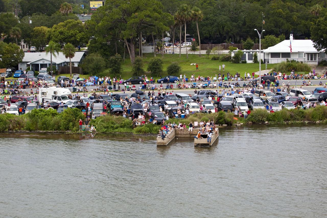 CAPE CANAVERAL, Fla. -- After 30 years and 135 missions, residents and visitors to Florida's Space Coast flock to a viewing site along U.S. 1 in Titusville to see the rocket's red glare of NASA's Space Shuttle Program soar for the last time. Space shuttle Atlantis is scheduled to liftoff at 11:26 a.m. EDT from Launch Pad 39A at NASA's Kennedy Space Center in Florida. On board will be four experienced astronauts -- STS-135 Commander Chris Ferguson, Pilot Doug Hurley, and Mission Specialists Sandy Magnus and Rex Walheim.    STS-135 will deliver the Raffaello multi-purpose logistics module packed with supplies and spare parts for the International Space Station. Atlantis also will fly the Robotic Refueling Mission experiment that will investigate the potential for robotically refueling existing satellites in orbit. In addition, Atlantis will return with a failed ammonia pump module to help NASA better understand the failure mechanism and improve pump designs for future systems. STS-135 will be the 33rd flight of Atlantis, the 37th shuttle mission to the space station, and the 135th and final mission of NASA's Space Shuttle Program. For more information visit, www.nasa.gov/mission_pages/shuttle/shuttlemissions/sts135/index.html. Photo credit: NASA/Frank Michaux