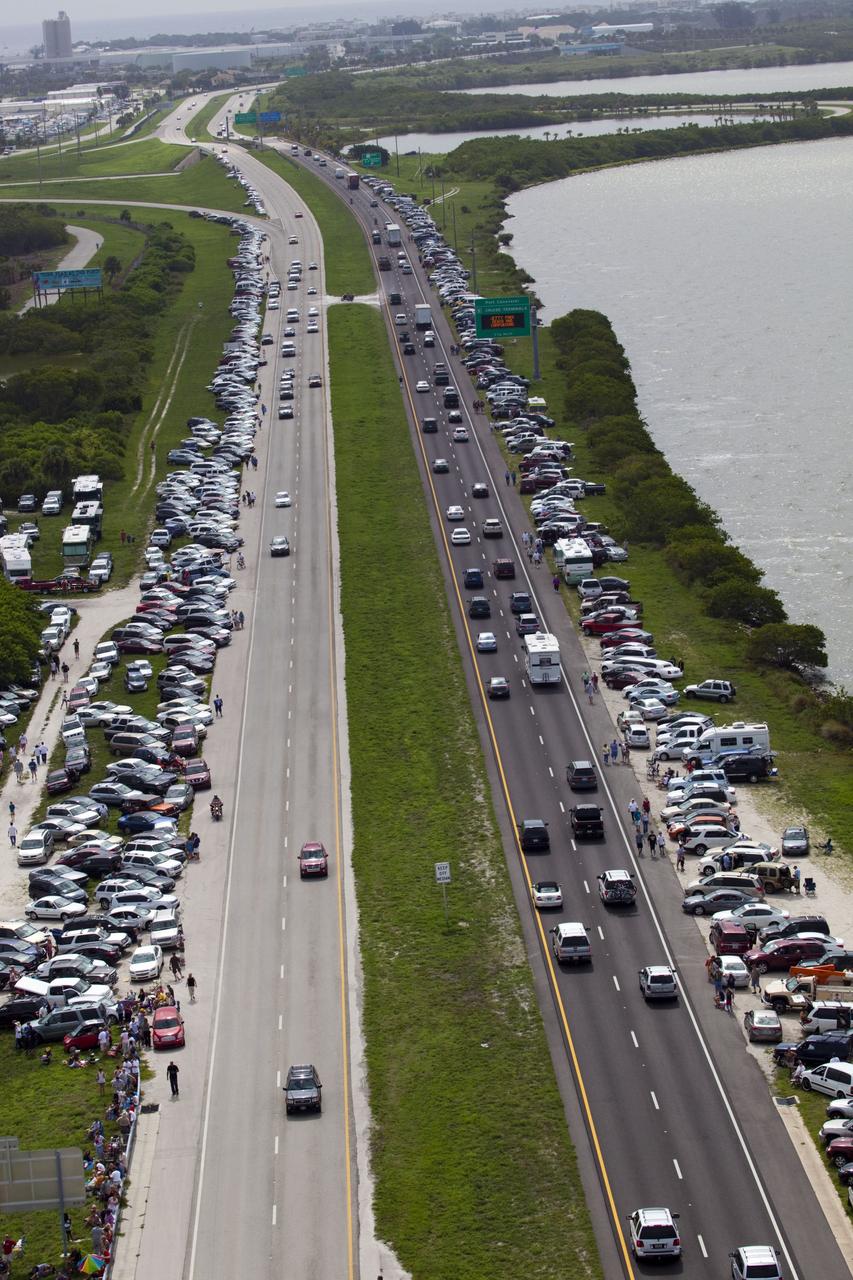 CAPE CANAVERAL, Fla. -- After 30 years and 135 missions, residents and visitors to Florida's Space Coast flock to S.R. 528 near Port Canaveral to see the rocket's red glare of NASA's Space Shuttle Program soar for the last time. Space shuttle Atlantis is scheduled to liftoff at 11:26 a.m. EDT from Launch Pad 39A at NASA's Kennedy Space Center in Florida. On board will be four experienced astronauts -- STS-135 Commander Chris Ferguson, Pilot Doug Hurley, and Mission Specialists Sandy Magnus and Rex Walheim.        STS-135 will deliver the Raffaello multi-purpose logistics module packed with supplies and spare parts for the International Space Station. Atlantis also will fly the Robotic Refueling Mission experiment that will investigate the potential for robotically refueling existing satellites in orbit. In addition, Atlantis will return with a failed ammonia pump module to help NASA better understand the failure mechanism and improve pump designs for future systems. STS-135 will be the 33rd flight of Atlantis, the 37th shuttle mission to the space station, and the 135th and final mission of NASA's Space Shuttle Program. For more information visit, www.nasa.gov/mission_pages/shuttle/shuttlemissions/sts135/index.html. Photo credit: NASA/Frank Michaux