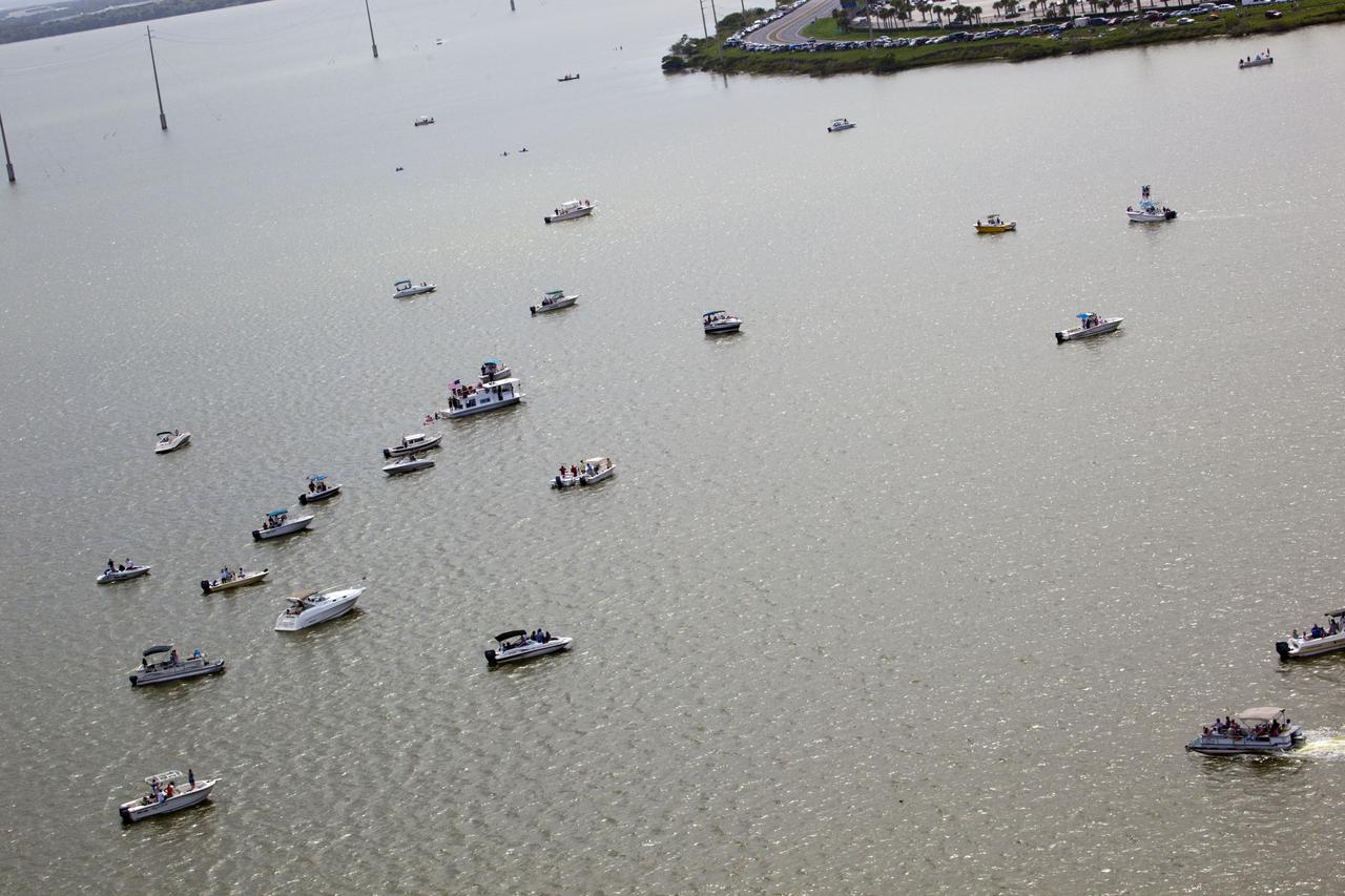 CAPE CANAVERAL, Fla. -- After 30 years and 135 missions, residents and visitors to Florida's Space Coast traverse the waters near Port Canaveral to see the rocket's red glare of NASA's Space Shuttle Program soar for the last time. Space shuttle Atlantis is scheduled to liftoff at 11:26 a.m. EDT from Launch Pad 39A at NASA's Kennedy Space Center in Florida. On board will be four experienced astronauts -- STS-135 Commander Chris Ferguson, Pilot Doug Hurley, and Mission Specialists Sandy Magnus and Rex Walheim.            STS-135 will deliver the Raffaello multi-purpose logistics module packed with supplies and spare parts for the International Space Station. Atlantis also will fly the Robotic Refueling Mission experiment that will investigate the potential for robotically refueling existing satellites in orbit. In addition, Atlantis will return with a failed ammonia pump module to help NASA better understand the failure mechanism and improve pump designs for future systems. STS-135 will be the 33rd flight of Atlantis, the 37th shuttle mission to the space station, and the 135th and final mission of NASA's Space Shuttle Program. For more information visit, www.nasa.gov/mission_pages/shuttle/shuttlemissions/sts135/index.html. Photo credit: NASA/Frank Michaux