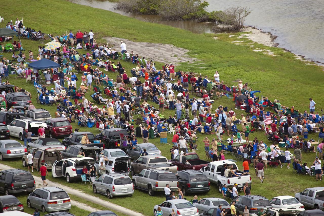CAPE CANAVERAL, Fla. -- After 30 years and 135 missions, invited guests congregate along the NASA Causeway to see the rocket's red glare of NASA's Space Shuttle Program soar for the last time. Space shuttle Atlantis is scheduled to liftoff at 11:26 a.m. EDT from Launch Pad 39A at NASA's Kennedy Space Center in Florida. On board will be four experienced astronauts -- STS-135 Commander Chris Ferguson, Pilot Doug Hurley, and Mission Specialists Sandy Magnus and Rex Walheim.          STS-135 will deliver the Raffaello multi-purpose logistics module packed with supplies and spare parts for the International Space Station. Atlantis also will fly the Robotic Refueling Mission experiment that will investigate the potential for robotically refueling existing satellites in orbit. In addition, Atlantis will return with a failed ammonia pump module to help NASA better understand the failure mechanism and improve pump designs for future systems. STS-135 will be the 33rd flight of Atlantis, the 37th shuttle mission to the space station, and the 135th and final mission of NASA's Space Shuttle Program. For more information visit, www.nasa.gov/mission_pages/shuttle/shuttlemissions/sts135/index.html. Photo credit: NASA/Frank Michaux