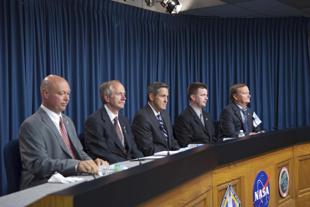 CAPE CANAVERAL, Fla. -- Members of the media gather for a post-launch news conference held in the Press Site auditorium at NASA's Kennedy Space Center in Florida, following the successful launch of space shuttle Atlantis on its STS-135 mission to the International Space Station. Seen here are NASA Public Affairs Officer Mike Curie (left) moderator; Associate Administrator for Space Operations Bill Gerstenmaier, Kennedy Center Director Bob Cabana, Shuttle Program Launch Integration Manager Mike Moses, and Shuttle Launch Director Mike Leinbach.   Atlantis began its final flight at 11:29 a.m. EDT on July 8. STS-135 will deliver the Raffaello multi-purpose logistics module packed with supplies and spare parts for the International Space Station. Atlantis also will fly the Robotic Refueling Mission experiment that will investigate the potential for robotically refueling existing satellites in orbit. In addition, Atlantis will return with a failed ammonia pump module to help NASA better understand the failure mechanism and improve pump designs for future systems. STS-135 will be the 33rd flight of Atlantis, the 37th shuttle mission to the space station, and the 135th and final mission of NASA's Space Shuttle Program. For more information, visit www.nasa.gov/mission_pages/shuttle/shuttlemissions/sts135/index.html. Photo credit: NASA/Jim Grossmann