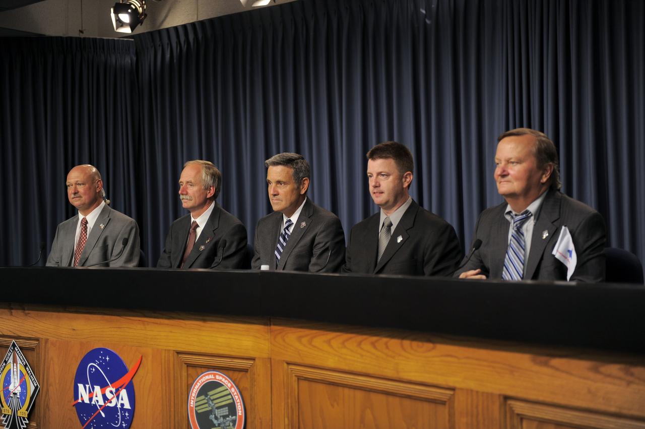 CAPE CANAVERAL, Fla. -- Members of the media gather for a post-launch news conference held in the Press Site auditorium at NASA's Kennedy Space Center in Florida, following the successful launch of space shuttle Atlantis on its STS-135 mission to the International Space Station. Seen here are NASA Public Affairs Officer Mike Curie (left) moderator; Associate Administrator for Space Operations Bill Gerstenmaier, Kennedy Center Director Bob Cabana, Shuttle Program Launch Integration Manager Mike Moses, and Shuttle Launch Director Mike Leinbach. Atlantis began its final flight at 11:29 a.m. EDT on July 8. STS-135 will deliver the Raffaello multi-purpose logistics module packed with supplies and spare parts for the International Space Station. Atlantis also will fly the Robotic Refueling Mission experiment that will investigate the potential for robotically refueling existing satellites in orbit. In addition, Atlantis will return with a failed ammonia pump module to help NASA better understand the failure mechanism and improve pump designs for future systems. STS-135 will be the 33rd flight of Atlantis, the 37th shuttle mission to the space station, and the 135th and final mission of NASA's Space Shuttle Program. For more information, visit www.nasa.gov/mission_pages/shuttle/shuttlemissions/sts135/index.html. Photo credit: NASA/Kim Shiflett