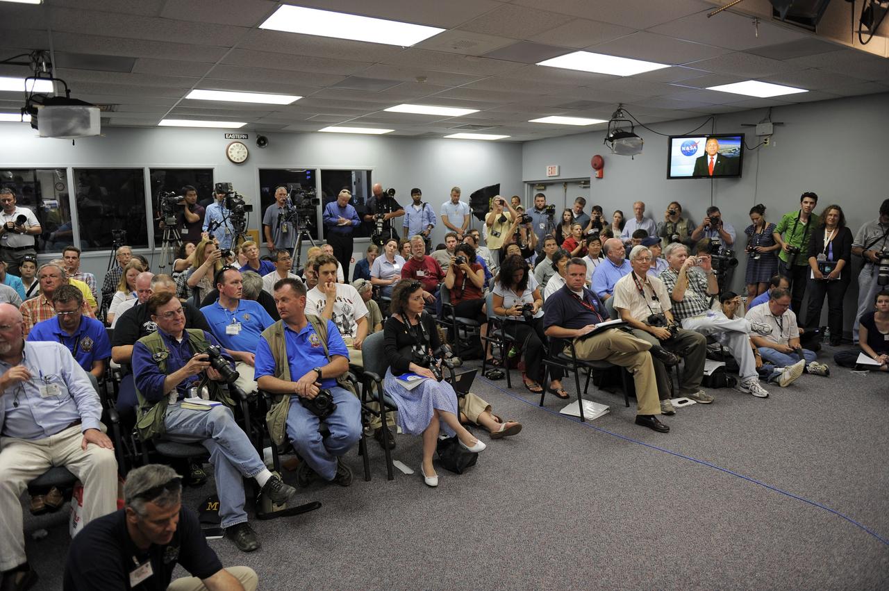 CAPE CANAVERAL, Fla. -- Members of the media gather for a post-launch news conference held in the Press Site auditorium at NASA's Kennedy Space Center in Florida, following the successful launch of space shuttle Atlantis on its STS-135 mission to the International Space Station. Atlantis began its final flight at 11:29 a.m. EDT on July 8. STS-135 will deliver the Raffaello multi-purpose logistics module packed with supplies and spare parts for the International Space Station. Atlantis also will fly the Robotic Refueling Mission experiment that will investigate the potential for robotically refueling existing satellites in orbit. In addition, Atlantis will return with a failed ammonia pump module to help NASA better understand the failure mechanism and improve pump designs for future systems. STS-135 will be the 33rd flight of Atlantis, the 37th shuttle mission to the space station, and the 135th and final mission of NASA's Space Shuttle Program. For more information, visit www.nasa.gov/mission_pages/shuttle/shuttlemissions/sts135/index.html. Photo credit: NASA/Kim Shiflett