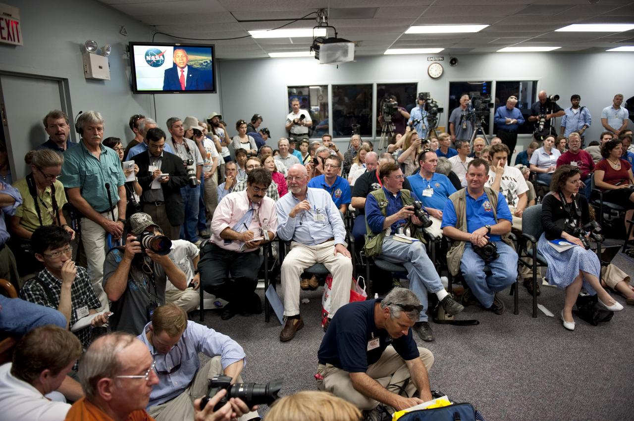 CAPE CANAVERAL, Fla. -- Members of the media gather for a post-launch news conference held in the Press Site auditorium at NASA's Kennedy Space Center in Florida, following the successful launch of space shuttle Atlantis on its STS-135 mission to the International Space Station. Atlantis began its final flight at 11:29 a.m. EDT on July 8. STS-135 will deliver the Raffaello multi-purpose logistics module packed with supplies and spare parts for the International Space Station. Atlantis also will fly the Robotic Refueling Mission experiment that will investigate the potential for robotically refueling existing satellites in orbit. In addition, Atlantis will return with a failed ammonia pump module to help NASA better understand the failure mechanism and improve pump designs for future systems. STS-135 will be the 33rd flight of Atlantis, the 37th shuttle mission to the space station, and the 135th and final mission of NASA's Space Shuttle Program. For more information, visit www.nasa.gov/mission_pages/shuttle/shuttlemissions/sts135/index.html. Photo credit: NASA/Kim Shiflett