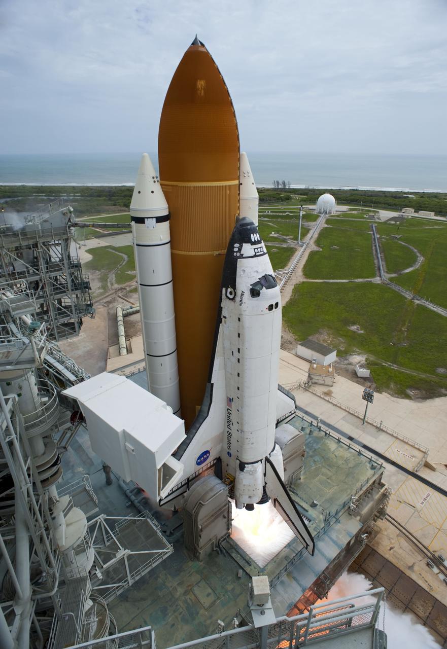 CAPE CANAVERAL, Fla. -- The engines ignite beneath space shuttle Atlantis on Launch Pad 39A on the Atlantic coastline at NASA's Kennedy Space Center in Florida.  Atlantis began its final flight, the STS-135 mission to the International Space Station, at 11:29 a.m. EDT July 8.    STS-135 will deliver the Raffaello multi-purpose logistics module packed with supplies and spare parts to the orbiting laboratory. Atlantis also is flying the Robotic Refueling Mission experiment that will investigate the potential for robotically refueling existing satellites in orbit. In addition, a failed ammonia pump module will be returned to Earth aboard Atlantis to help NASA better understand the failure mechanism and improve pump designs for future systems. STS-135 is the 33rd flight of Atlantis, the 37th shuttle mission to the space station, and the 135th and final mission of NASA's Space Shuttle Program. For more information, visit www.nasa.gov/mission_pages/shuttle/shuttlemissions/sts135/index.html. Photo credit: NASA/Tony Gray and Tom Farrar