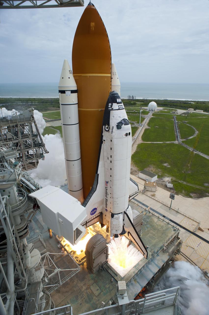 CAPE CANAVERAL, Fla. -- The engines roar to life beneath space shuttle Atlantis on Launch Pad 39A on the Atlantic coastline at NASA's Kennedy Space Center in Florida.  Atlantis began its final flight, the STS-135 mission to the International Space Station, at 11:29 a.m. EDT July 8.    STS-135 will deliver the Raffaello multi-purpose logistics module packed with supplies and spare parts to the orbiting laboratory. Atlantis also is flying the Robotic Refueling Mission experiment that will investigate the potential for robotically refueling existing satellites in orbit. In addition, a failed ammonia pump module will be returned to Earth aboard Atlantis to help NASA better understand the failure mechanism and improve pump designs for future systems. STS-135 is the 33rd flight of Atlantis, the 37th shuttle mission to the space station, and the 135th and final mission of NASA's Space Shuttle Program. For more information, visit www.nasa.gov/mission_pages/shuttle/shuttlemissions/sts135/index.html. Photo credit: NASA/Tony Gray and Tom Farrar