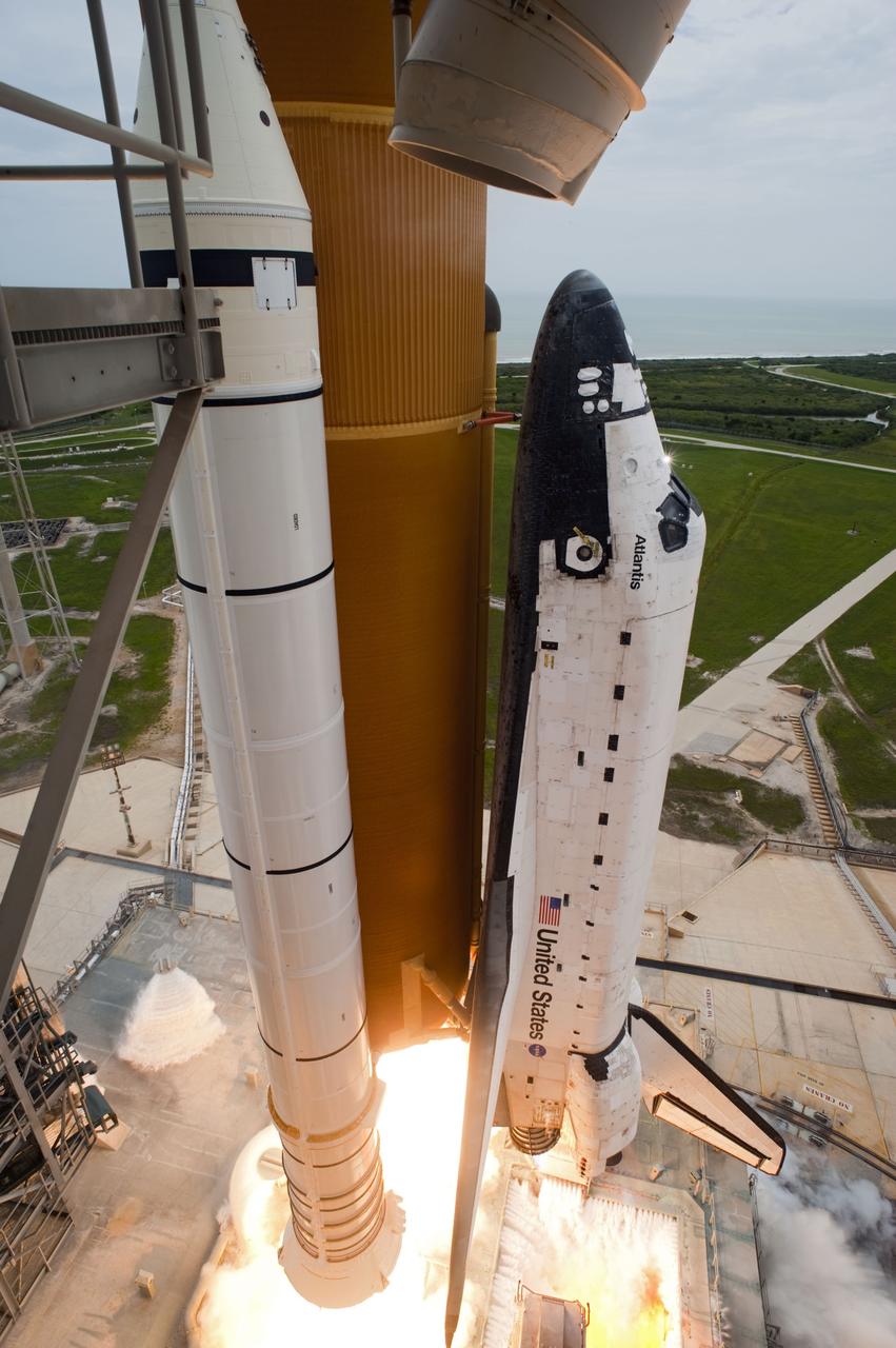 CAPE CANAVERAL, Fla. -- The engines' glare beneath space shuttle Atlantis heralds liftoff from Launch Pad 39A at NASA's Kennedy Space Center in Florida.  Atlantis began its final flight, the STS-135 mission to the International Space Station, at 11:29 a.m. EDT July 8.    STS-135 will deliver the Raffaello multi-purpose logistics module packed with supplies and spare parts to the orbiting laboratory. Atlantis also is flying the Robotic Refueling Mission experiment that will investigate the potential for robotically refueling existing satellites in orbit. In addition, a failed ammonia pump module will be returned to Earth aboard Atlantis to help NASA better understand the failure mechanism and improve pump designs for future systems. STS-135 is the 33rd flight of Atlantis, the 37th shuttle mission to the space station, and the 135th and final mission of NASA's Space Shuttle Program. For more information, visit www.nasa.gov/mission_pages/shuttle/shuttlemissions/sts135/index.html. Photo credit: NASA/Tony Gray and Tom Farrar
