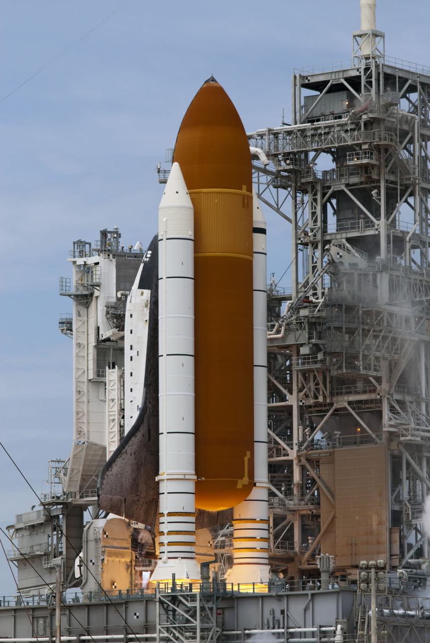 CAPE CANAVERAL, Fla. -- At NASA's Kennedy Space Center in Florida, space shuttle Atlantis' main engines and solid rocket boosters ignite on Launch Pad 39A as it lifts off on its STS-135 mission to the International Space Station.      Atlantis with its crew of four; Commander Chris Ferguson, Pilot Doug Hurley, Mission Specialists Sandy Magnus and Rex Walheim, lifted off at 11:29 a.m. EDT on July 8, 2011 to deliver the Raffaello multi-purpose logistics module packed with supplies and spare parts for the station. Atlantis also will fly the Robotic Refueling Mission experiment that will investigate the potential for robotically refueling existing satellites in orbit. In addition, Atlantis will return with a failed ammonia pump module to help NASA better understand the failure mechanism and improve pump designs for future systems. STS-135 is the 33rd flight of Atlantis, the 37th shuttle mission to the space station, and the 135th and final mission of NASA's Space Shuttle Program. For more information, visit www.nasa.gov/mission_pages/shuttle/shuttlemissions/sts135/index.html. Photo credit: NASA/Rusty Backer and Mike Gayle