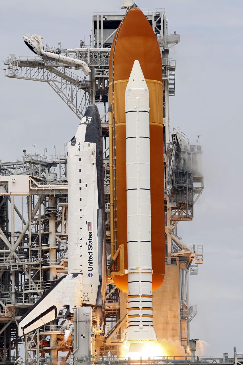 CAPE CANAVERAL, Fla. -- At NASA's Kennedy Space Center in Florida, space shuttle Atlantis' main engines ignite and solid rocket boosters ignite on Launch Pad 39A leaving behind a twin stream of flame as it lifts off on its STS-135 mission to the International Space Station.    Atlantis with its crew of four; Commander Chris Ferguson, Pilot Doug Hurley, Mission Specialists Sandy Magnus and Rex Walheim, lifted off at 11:29 a.m. EDT on July 8, 2011 to deliver the Raffaello multi-purpose logistics module packed with supplies and spare parts for the International Space Station. Atlantis also will fly the Robotic Refueling Mission experiment that will investigate the potential for robotically refueling existing satellites in orbit. In addition, Atlantis will return with a failed ammonia pump module to help NASA better understand the failure mechanism and improve pump designs for future systems. STS-135 is the 33rd flight of Atlantis, the 37th shuttle mission to the space station, and the 135th and final mission of NASA's Space Shuttle Program. For more information, visit www.nasa.gov/mission_pages/shuttle/shuttlemissions/sts135/index.html. Photo credit: NASA/Rusty Backer and Mike Gayle