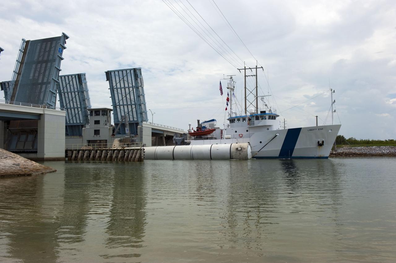 CAPE CANAVERAL, Fla. -- Liberty Star, one of NASA's solid rocket booster retrieval ships, tows a spent booster from space shuttle Atlantis' final launch, to Port Canaveral in Florida.  The shuttle's two solid rocket booster casings and associated flight hardware are recovered in the Atlantic Ocean after every launch by Freedom Star and Liberty Star. The boosters impact the Atlantic about seven minutes after liftoff and the retrieval ships are stationed about 10 miles from the impact area at the time of splashdown. After the spent segments are processed, they will be transported to Utah, where they will be deserviced and stored, if needed.        Atlantis began its final flight at 11:29 a.m. EDT on July 8 to deliver the Raffaello multi-purpose logistics module packed with supplies and spare parts for the International Space Station. Atlantis also delivers the Robotic Refueling Mission experiment that will investigate the potential for robotically refueling existing satellites in orbit to the station. In addition, Atlantis will return with a failed ammonia pump module to help NASA better understand the failure mechanism and improve pump designs for future systems. STS-135 is the 33rd flight of Atlantis, the 37th shuttle mission to the space station, and the 135th and final mission of NASA's Space Shuttle Program. For more information, visit www.nasa.gov/mission_pages/shuttle/shuttlemissions/sts135/index.html. Photo credit: NASA/Kim Shiflett