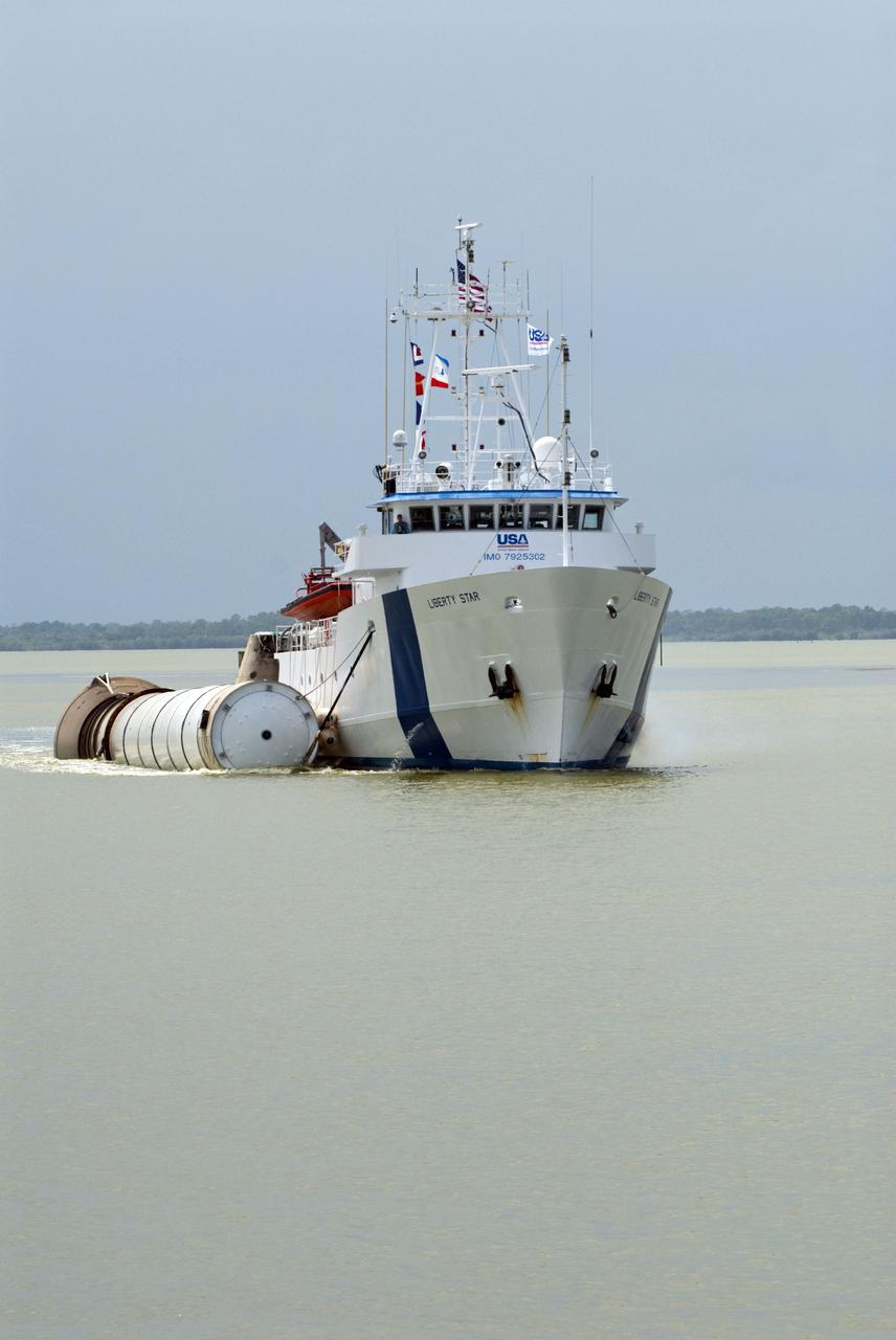 CAPE CANAVERAL, Fla. -- Liberty Star, one of NASA's solid rocket booster retrieval ships, tows a spent booster from space shuttle Atlantis' final launch, to Port Canaveral in Florida.  The shuttle's two solid rocket booster casings and associated flight hardware are recovered in the Atlantic Ocean after every launch by Freedom Star and Liberty Star. The boosters impact the Atlantic about seven minutes after liftoff and the retrieval ships are stationed about 10 miles from the impact area at the time of splashdown. After the spent segments are processed, they will be transported to Utah, where they will be deserviced and stored, if needed.        Atlantis began its final flight at 11:29 a.m. EDT on July 8 to deliver the Raffaello multi-purpose logistics module packed with supplies and spare parts for the International Space Station. Atlantis also delivers the Robotic Refueling Mission experiment that will investigate the potential for robotically refueling existing satellites in orbit to the station. In addition, Atlantis will return with a failed ammonia pump module to help NASA better understand the failure mechanism and improve pump designs for future systems. STS-135 is the 33rd flight of Atlantis, the 37th shuttle mission to the space station, and the 135th and final mission of NASA's Space Shuttle Program. For more information, visit www.nasa.gov/mission_pages/shuttle/shuttlemissions/sts135/index.html. Photo credit: NASA/Kim Shiflett