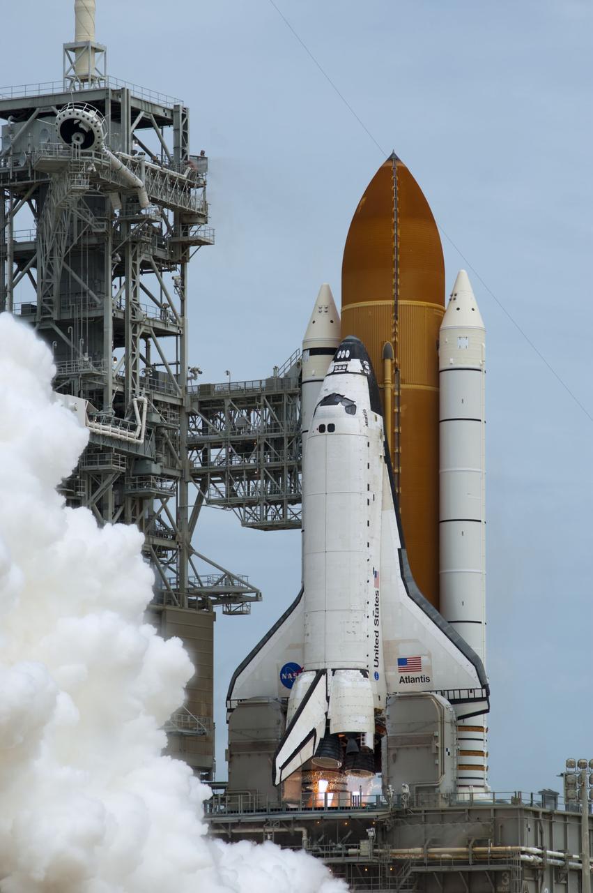 CAPE CANAVERAL, Fla. -- At NASA's Kennedy Space Center in Florida, space shuttle Atlantis' main engines ignite on Launch Pad 39A producing billows of steam and smoke as it lifts off on its STS-135 mission to the International Space Station.          Atlantis with its crew of four; Commander Chris Ferguson, Pilot Doug Hurley, Mission Specialists Sandy Magnus and Rex Walheim, lifted off at 11:29 a.m. EDT on July 8, 2011 to deliver the Raffaello multi-purpose logistics module packed with supplies and spare parts for the station. Atlantis also will fly the Robotic Refueling Mission experiment that will investigate the potential for robotically refueling existing satellites in orbit. In addition, Atlantis will return with a failed ammonia pump module to help NASA better understand the failure mechanism and improve pump designs for future systems. STS-135 is the 33rd flight of Atlantis, the 37th shuttle mission to the space station, and the 135th and final mission of NASA's Space Shuttle Program. For more information, visit www.nasa.gov/mission_pages/shuttle/shuttlemissions/sts135/index.html. Photo credit: NASA/Sandra Joseph and Kevin O'Connell