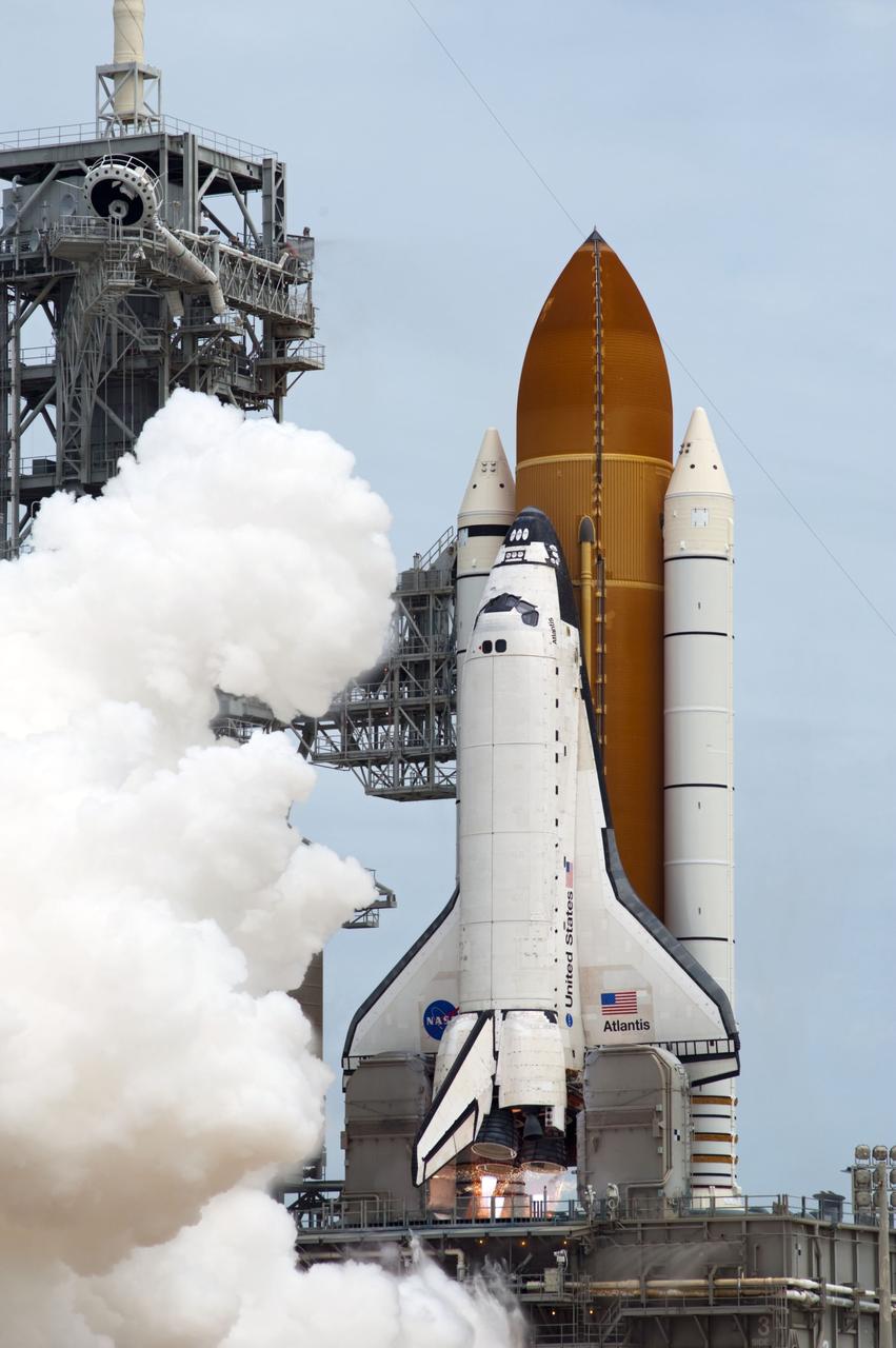 CAPE CANAVERAL, Fla. -- At NASA's Kennedy Space Center in Florida, space shuttle Atlantis' main engines ignite on Launch Pad 39A producing billows of steam and smoke as it lifts off on its STS-135 mission to the International Space Station.          Atlantis with its crew of four; Commander Chris Ferguson, Pilot Doug Hurley, Mission Specialists Sandy Magnus and Rex Walheim, lifted off at 11:29 a.m. EDT on July 8, 2011 to deliver the Raffaello multi-purpose logistics module packed with supplies and spare parts for the station. Atlantis also will fly the Robotic Refueling Mission experiment that will investigate the potential for robotically refueling existing satellites in orbit. In addition, Atlantis will return with a failed ammonia pump module to help NASA better understand the failure mechanism and improve pump designs for future systems. STS-135 is the 33rd flight of Atlantis, the 37th shuttle mission to the space station, and the 135th and final mission of NASA's Space Shuttle Program. For more information, visit www.nasa.gov/mission_pages/shuttle/shuttlemissions/sts135/index.html. Photo credit: NASA/Sandra Joseph and Kevin O'Connell