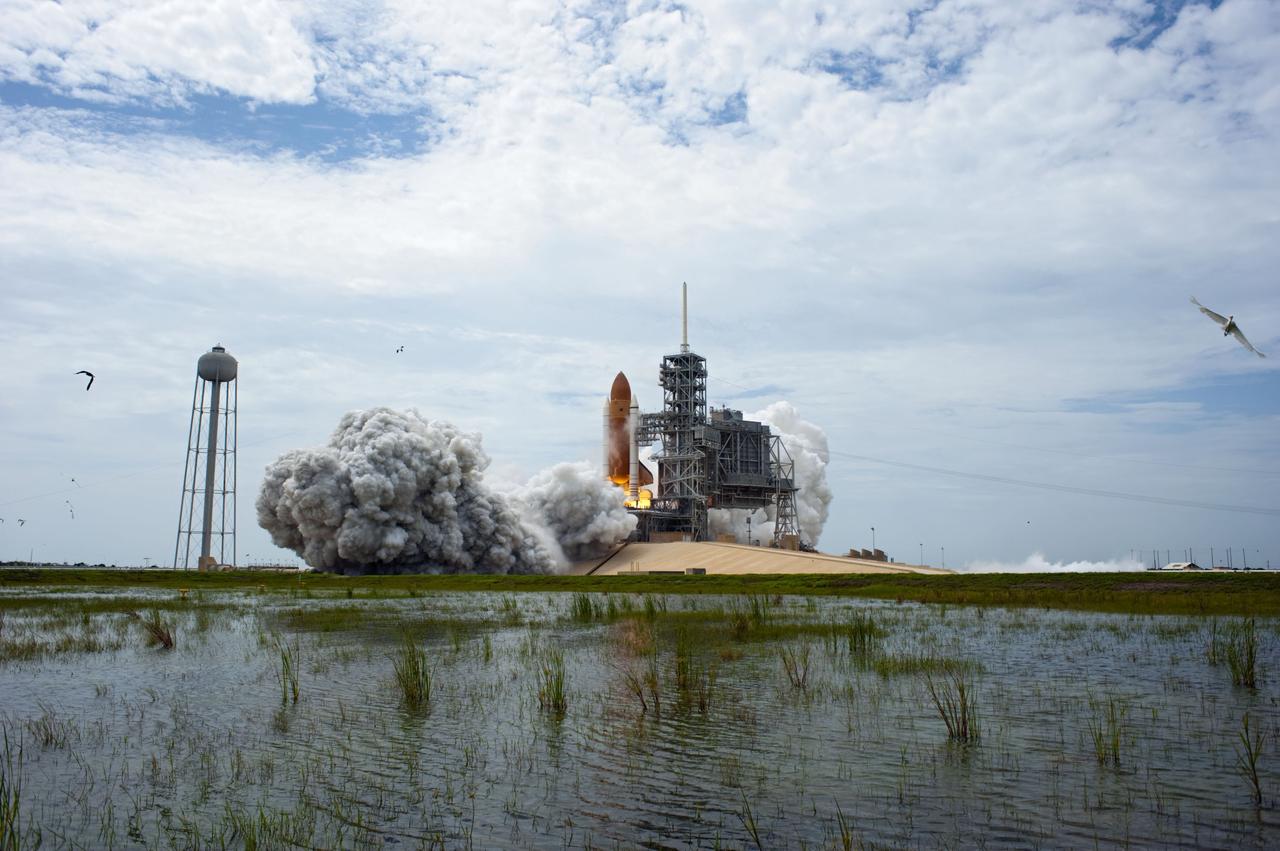 CAPE CANAVERAL, Fla. -- At NASA's Kennedy Space Center in Florida, space shuttle Atlantis' main engines and solid rocket boosters ignite on Launch Pad 39A as it lifts off on its STS-135 mission to the International Space Station.        Atlantis with its crew of four; Commander Chris Ferguson, Pilot Doug Hurley, Mission Specialists Sandy Magnus and Rex Walheim, lifted off at 11:29 a.m. EDT on July 8, 2011 to deliver the Raffaello multi-purpose logistics module packed with supplies and spare parts for the station. Atlantis also will fly the Robotic Refueling Mission experiment that will investigate the potential for robotically refueling existing satellites in orbit. In addition, Atlantis will return with a failed ammonia pump module to help NASA better understand the failure mechanism and improve pump designs for future systems. STS-135 is the 33rd flight of Atlantis, the 37th shuttle mission to the space station, and the 135th and final mission of NASA's Space Shuttle Program. For more information, visit www.nasa.gov/mission_pages/shuttle/shuttlemissions/sts135/index.html. Photo credit: NASA/Sandra Joseph and Kevin O'Connell