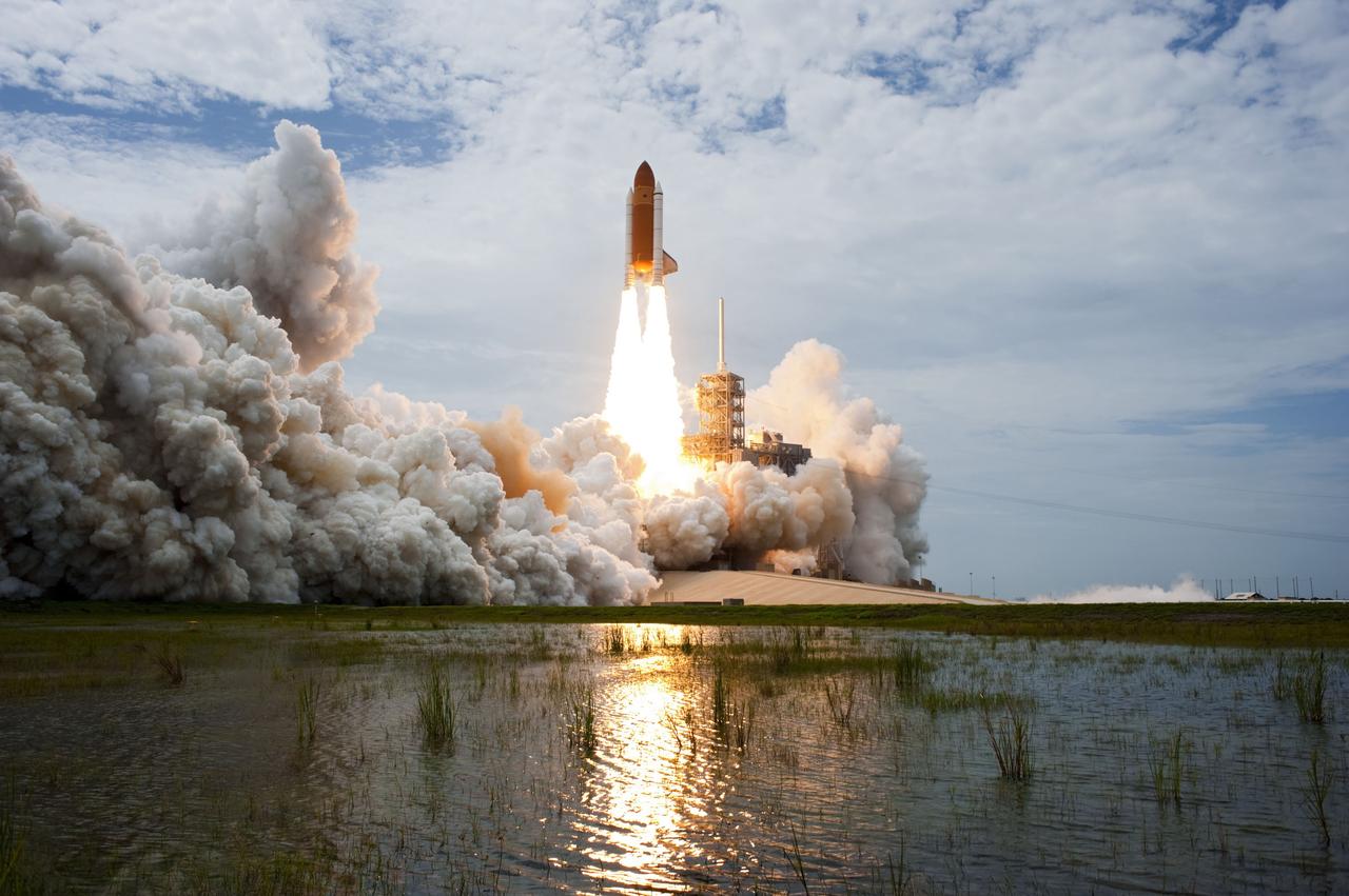 CAPE CANAVERAL, Fla. -- At NASA's Kennedy Space Center in Florida, space shuttle Atlantis lifts off of Launch Pad 39A leaving behind  billows of steam and smoke as it heads into the clouds on its STS-135 mission to the International Space Station.        Atlantis with its crew of four; Commander Chris Ferguson, Pilot Doug Hurley, Mission Specialists Sandy Magnus and Rex Walheim, lifted off at 11:29 a.m. EDT on July 8, 2011 to deliver the Raffaello multi-purpose logistics module packed with supplies and spare parts for the station. Atlantis also will fly the Robotic Refueling Mission experiment that will investigate the potential for robotically refueling existing satellites in orbit. In addition, Atlantis will return with a failed ammonia pump module to help NASA better understand the failure mechanism and improve pump designs for future systems. STS-135 is the 33rd flight of Atlantis, the 37th shuttle mission to the space station, and the 135th and final mission of NASA's Space Shuttle Program. For more information, visit www.nasa.gov/mission_pages/shuttle/shuttlemissions/sts135/index.html. Photo credit: NASA/Sandra Joseph and Kevin O'Connell