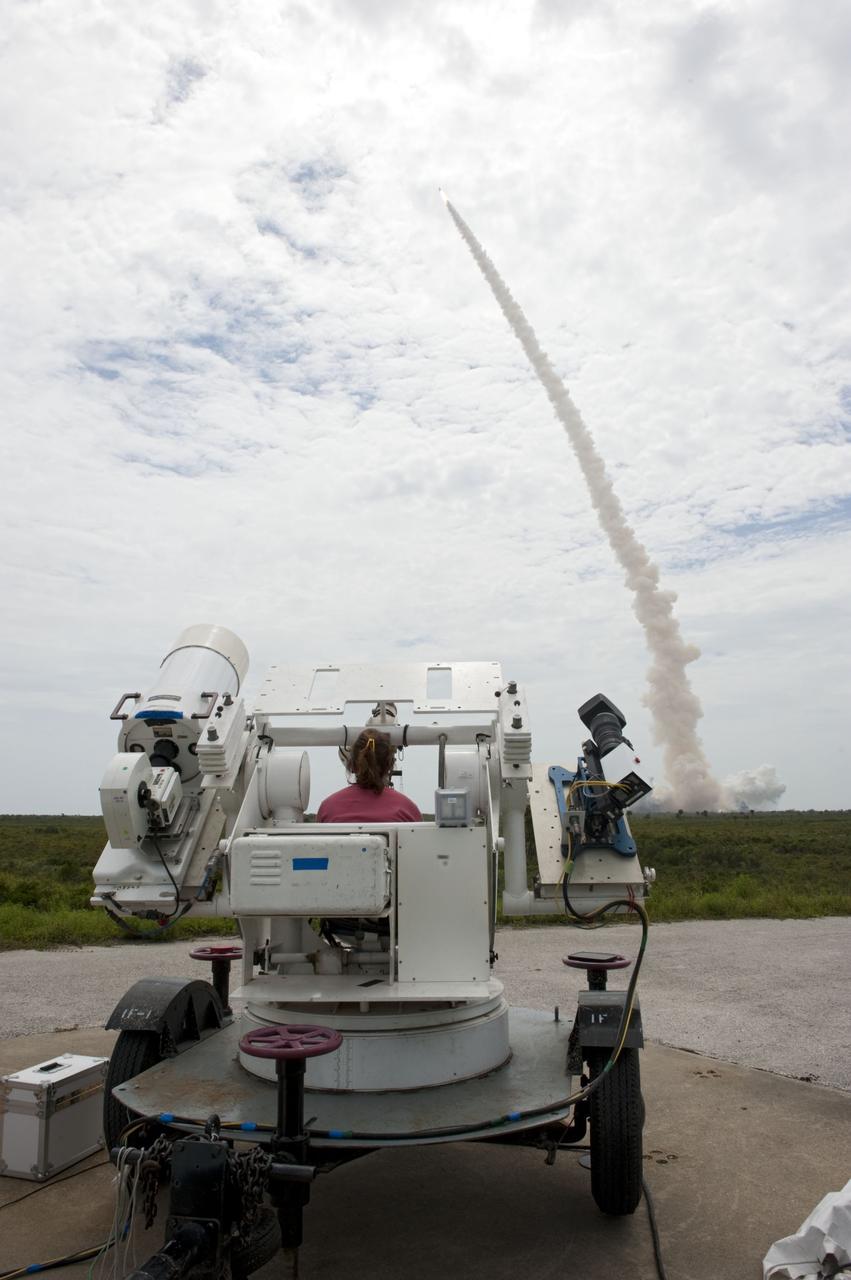 CAPE CANAVERAL, Fla. -- NASA photographer Sandra Joseph aims her remote camera tracker on space shuttle Atlantis at it lifts off from Launch Pad 39A at NASA's Kennedy Space Center in Florida beginning its STS-135 mission to the International Space Station.          Atlantis with its crew of four; Commander Chris Ferguson, Pilot Doug Hurley, Mission Specialists Sandy Magnus and Rex Walheim, lifted off at 11:29 a.m. EDT on July 8, 2011 to deliver the Raffaello multi-purpose logistics module packed with supplies and spare parts for the station. Atlantis also will fly the Robotic Refueling Mission experiment that will investigate the potential for robotically refueling existing satellites in orbit. In addition, Atlantis will return with a failed ammonia pump module to help NASA better understand the failure mechanism and improve pump designs for future systems. STS-135 is the 33rd flight of Atlantis, the 37th shuttle mission to the space station, and the 135th and final mission of NASA's Space Shuttle Program. For more information, visit www.nasa.gov/mission_pages/shuttle/shuttlemissions/sts135/index.html. Photo credit: NASA/Sandra Joseph