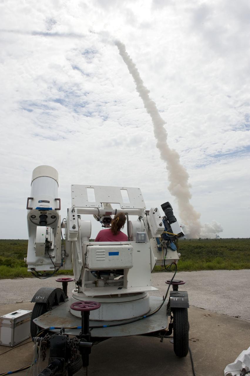 CAPE CANAVERAL, Fla. -- NASA photographer Sandra Joseph aims her remote camera tracker on space shuttle Atlantis at it lifts off from Launch Pad 39A at NASA's Kennedy Space Center in Florida beginning its STS-135 mission to the International Space Station.          Atlantis with its crew of four; Commander Chris Ferguson, Pilot Doug Hurley, Mission Specialists Sandy Magnus and Rex Walheim, lifted off at 11:29 a.m. EDT on July 8, 2011 to deliver the Raffaello multi-purpose logistics module packed with supplies and spare parts for the station. Atlantis also will fly the Robotic Refueling Mission experiment that will investigate the potential for robotically refueling existing satellites in orbit. In addition, Atlantis will return with a failed ammonia pump module to help NASA better understand the failure mechanism and improve pump designs for future systems. STS-135 is the 33rd flight of Atlantis, the 37th shuttle mission to the space station, and the 135th and final mission of NASA's Space Shuttle Program. For more information, visit www.nasa.gov/mission_pages/shuttle/shuttlemissions/sts135/index.html. Photo credit: NASA/Sandra Joseph