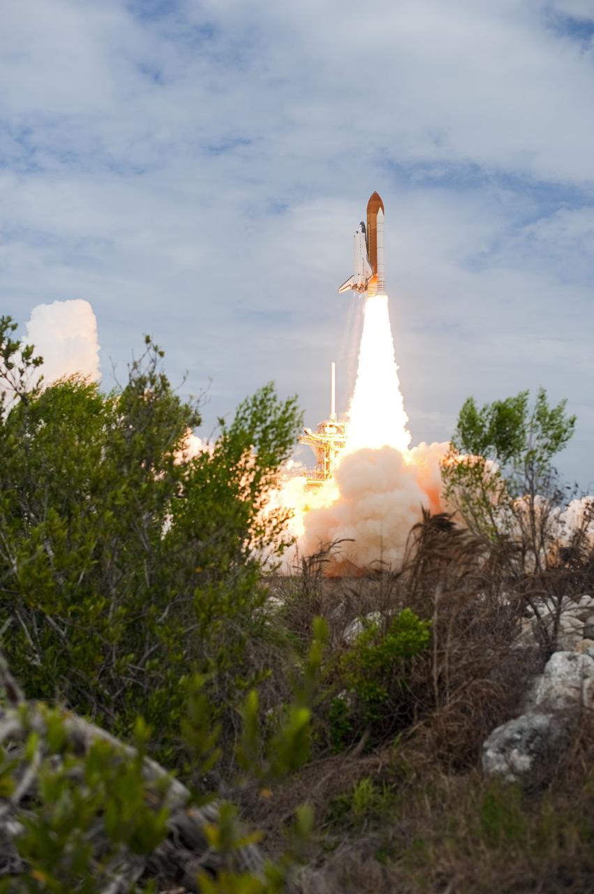 CAPE CANAVERAL, Fla. -- At NASA's Kennedy Space Center in Florida, space shuttle Atlantis lifts off of Launch Pad 39A leaving behind a billow of steam and smoke as it heads into the clouds on its STS-135 mission to the International Space Station. Atlantis with its crew of four; Commander Chris Ferguson, Pilot Doug Hurley, Mission Specialists Sandy Magnus and Rex Walheim, lifted off at 11:29 a.m. EDT on July 8, 2011 to deliver the Raffaello multi-purpose logistics module packed with supplies and spare parts for the International Space Station. Atlantis also will fly the Robotic Refueling Mission experiment that will investigate the potential for robotically refueling existing satellites in orbit. In addition, Atlantis will return with a failed ammonia pump module to help NASA better understand the failure mechanism and improve pump designs for future systems. STS-135 is the 33rd flight of Atlantis, the 37th shuttle mission to the space station, and the 135th and final mission of NASA's Space Shuttle Program. For more information, visit www.nasa.gov/mission_pages/shuttle/shuttlemissions/sts135/index.html. Photo credit: NASA/Sandra Joseph and Kevin O'Connell
