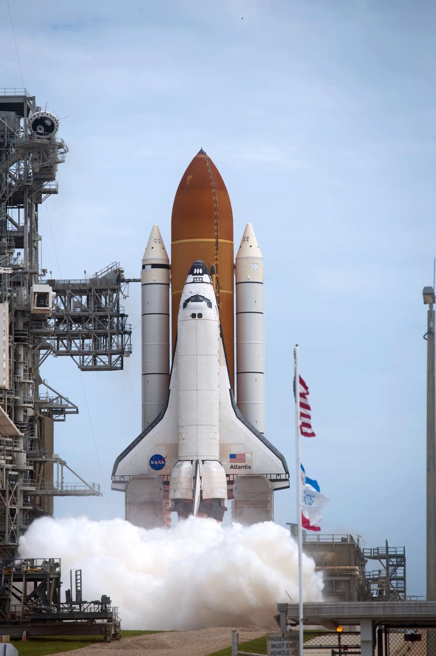 CAPE CANAVERAL, Fla. -- An exhaust cloud forms as the engines ignite beneath space shuttle Atlantis on Launch Pad 39A at NASA's Kennedy Space Center in Florida.  Atlantis began its final flight, the STS-135 mission to the International Space Station, at 11:29 a.m. EDT July 8.    STS-135 will deliver the Raffaello multi-purpose logistics module packed with supplies and spare parts to the orbiting laboratory. Atlantis also is flying the Robotic Refueling Mission experiment that will investigate the potential for robotically refueling existing satellites in orbit. In addition, a failed ammonia pump module will be returned to Earth aboard Atlantis to help NASA better understand the failure mechanism and improve pump designs for future systems. STS-135 is the 33rd flight of Atlantis, the 37th shuttle mission to the space station, and the 135th and final mission of NASA's Space Shuttle Program. For more information, visit www.nasa.gov/mission_pages/shuttle/shuttlemissions/sts135/index.html. Photo credit: NASA/Tony Gray and Tom Farrar