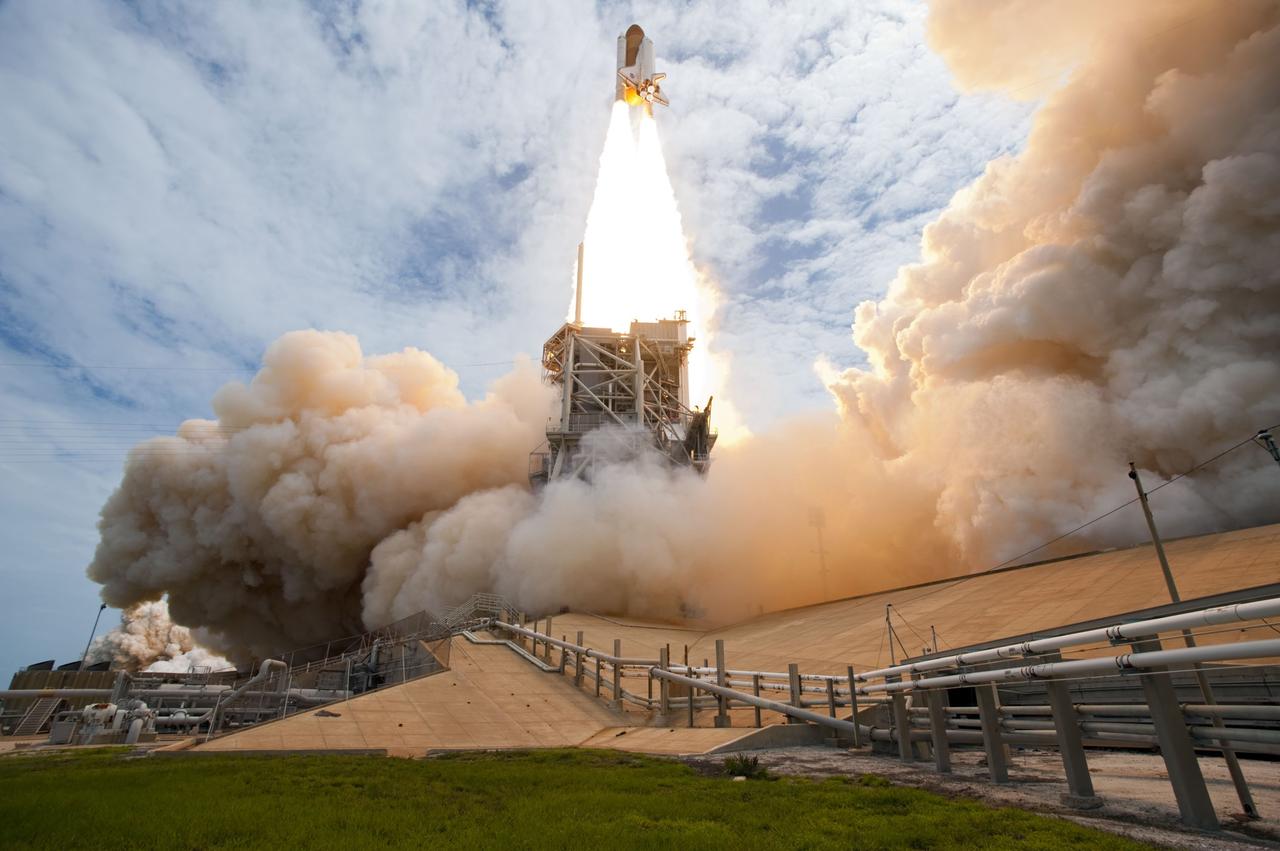 CAPE CANAVERAL, Fla. -- At NASA's Kennedy Space Center in Florida, space shuttle Atlantis lifts off on twin columns of flame from Launch Pad 39A on its way to space on the STS-135 mission to the International Space Station.      Atlantis with its crew of four; Commander Chris Ferguson, Pilot Doug Hurley, Mission Specialists Sandy Magnus and Rex Walheim, lifted off at 11:29 a.m. EDT on July 8, 2011 to deliver the Raffaello multi-purpose logistics module packed with supplies and spare parts for the station. Atlantis also will fly the Robotic Refueling Mission experiment that will investigate the potential for robotically refueling existing satellites in orbit. In addition, Atlantis will return with a failed ammonia pump module to help NASA better understand the failure mechanism and improve pump designs for future systems. STS-135 is the 33rd flight of Atlantis, the 37th shuttle mission to the space station, and the 135th and final mission of NASA's Space Shuttle Program. For more information, visit www.nasa.gov/mission_pages/shuttle/shuttlemissions/sts135/index.html. Photo credit: NASA/Tony Gray and Tom Farrar