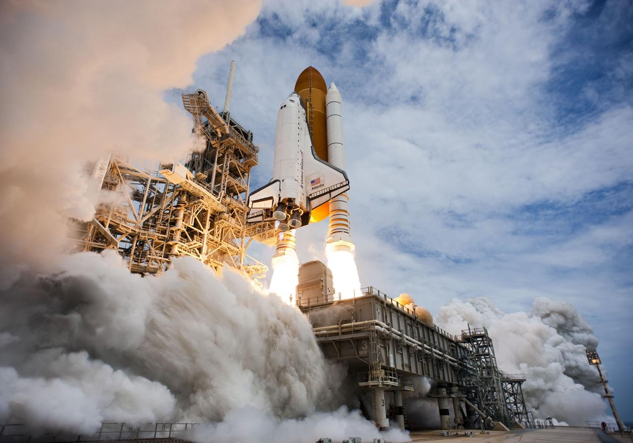 CAPE CANAVERAL, Fla. -- At NASA's Kennedy Space Center in Florida, space shuttle Atlantis lifts off on twin columns of flame from Launch Pad 39A headed for space on the STS-135 mission to the International Space Station.          Atlantis with its crew of four; Commander Chris Ferguson, Pilot Doug Hurley, Mission Specialists Sandy Magnus and Rex Walheim, lifted off at 11:29 a.m. EDT on July 8, 2011 to deliver the Raffaello multi-purpose logistics module packed with supplies and spare parts for the station. Atlantis also will fly the Robotic Refueling Mission experiment that will investigate the potential for robotically refueling existing satellites in orbit. In addition, Atlantis will return with a failed ammonia pump module to help NASA better understand the failure mechanism and improve pump designs for future systems. STS-135 is the 33rd flight of Atlantis, the 37th shuttle mission to the space station, and the 135th and final mission of NASA's Space Shuttle Program. For more information, visit www.nasa.gov/mission_pages/shuttle/shuttlemissions/sts135/index.html. Photo credit: NASA/Tony Gray and Tom Farrar