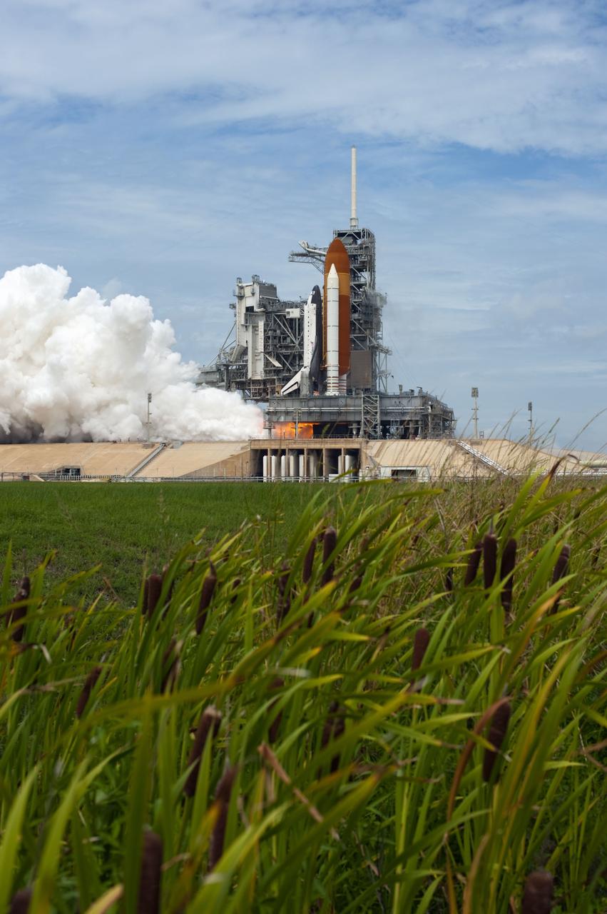CAPE CANAVERAL, Fla. -- At NASA's Kennedy Space Center in Florida, space shuttle Atlantis' main engines and solid rocket boosters ignite on Launch Pad 39A producing billows of smoke and steam as it lifts off on its STS-135 mission to the International Space Station.        Atlantis with its crew of four; Commander Chris Ferguson, Pilot Doug Hurley, Mission Specialists Sandy Magnus and Rex Walheim, lifted off at 11:29 a.m. EDT on July 8, 2011 to deliver the Raffaello multi-purpose logistics module packed with supplies and spare parts for the station. Atlantis also will fly the Robotic Refueling Mission experiment that will investigate the potential for robotically refueling existing satellites in orbit. In addition, Atlantis will return with a failed ammonia pump module to help NASA better understand the failure mechanism and improve pump designs for future systems. STS-135 is the 33rd flight of Atlantis, the 37th shuttle mission to the space station, and the 135th and final mission of NASA's Space Shuttle Program. For more information, visit www.nasa.gov/mission_pages/shuttle/shuttlemissions/sts135/index.html. Photo credit: NASA/Tony Gray and Tom Farrar