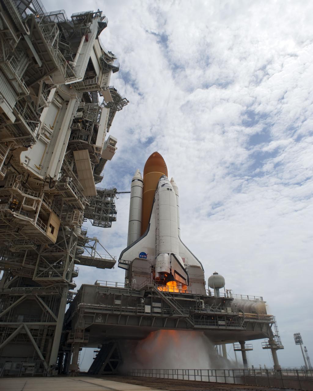 CAPE CANAVERAL, Fla. -- Smoke and steam begins to billow outward as space shuttle Atlantis' main engines are ignited for liftoff at Launch Pad 39A at NASA's Kennedy Space Center in Florida as it begins its STS-135 mission to the International Space Station.      Atlantis with its crew of four; Commander Chris Ferguson, Pilot Doug Hurley, Mission Specialists Sandy Magnus and Rex Walheim, lifted off at 11:29 a.m. EDT on July 8, 2011 to deliver the Raffaello multi-purpose logistics module packed with supplies and spare parts for the station. Atlantis also will fly the Robotic Refueling Mission experiment that will investigate the potential for robotically refueling existing satellites in orbit. In addition, Atlantis will return with a failed ammonia pump module to help NASA better understand the failure mechanism and improve pump designs for future systems. STS-135 is the 33rd flight of Atlantis, the 37th shuttle mission to the space station, and the 135th and final mission of NASA's Space Shuttle Program. For more information, visit www.nasa.gov/mission_pages/shuttle/shuttlemissions/sts135/index.html. Photo credit: NASA/Tony Gray and Tom Farrar