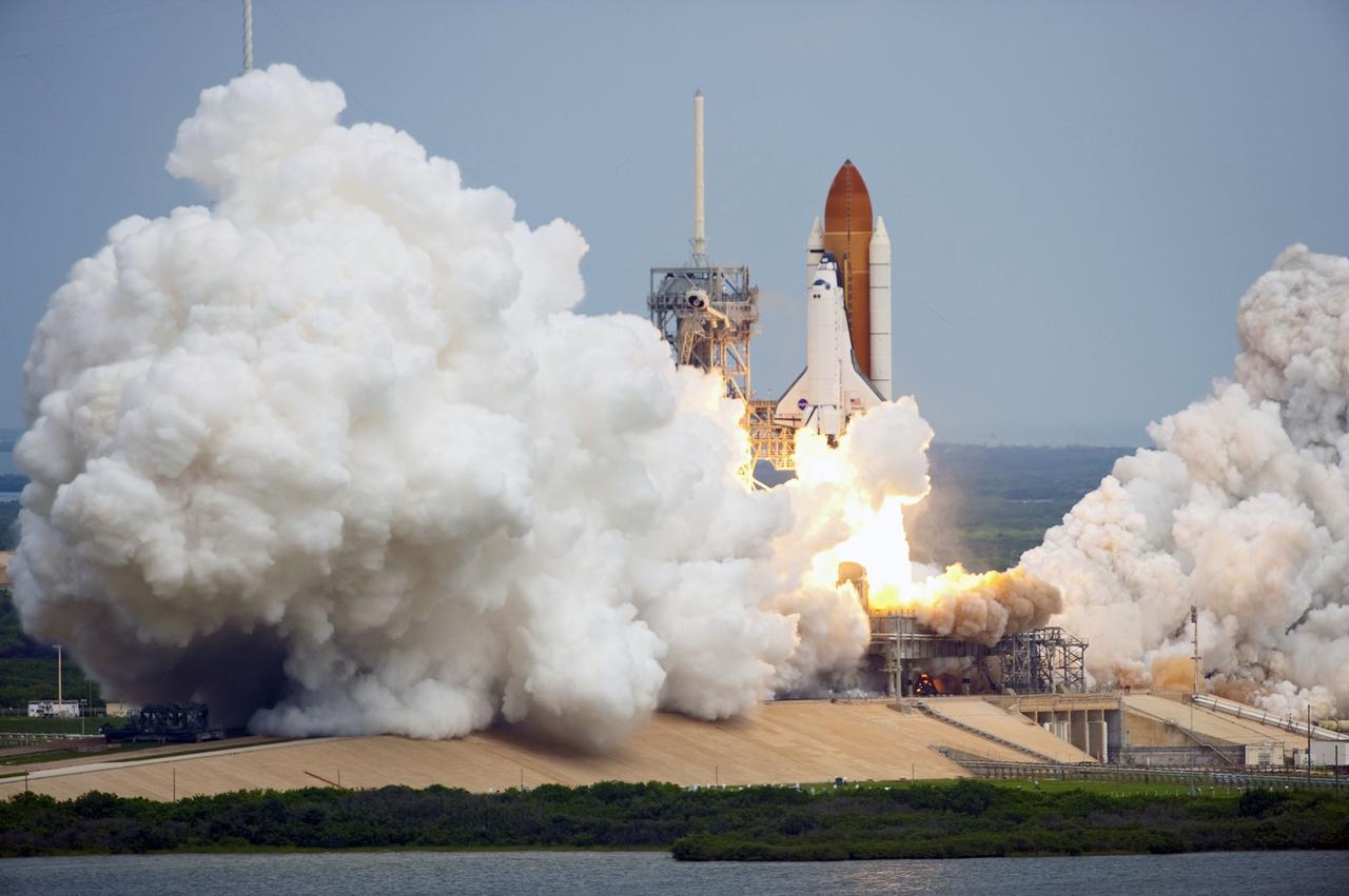 CAPE CANAVERAL, Fla. -- At NASA's Kennedy Space Center in Florida, space shuttle Atlantis lifts off of Launch Pad 39A leaving behind billows of steam and smoke as it heads past the tower on its STS-135 mission to the International Space Station. Atlantis with its crew of four; Commander Chris Ferguson, Pilot Doug Hurley, Mission Specialists Sandy Magnus and Rex Walheim, lifted off at 11:29 a.m. EDT on July 8, 2011 to deliver the Raffaello multi-purpose logistics module packed with supplies and spare parts for the International Space Station. Atlantis also will fly the Robotic Refueling Mission experiment that will investigate the potential for robotically refueling existing satellites in orbit. In addition, Atlantis will return with a failed ammonia pump module to help NASA better understand the failure mechanism and improve pump designs for future systems. STS-135 is the 33rd flight of Atlantis, the 37th shuttle mission to the space station, and the 135th and final mission of NASA's Space Shuttle Program. For more information, visit www.nasa.gov/mission_pages/shuttle/shuttlemissions/sts135/index.html. Photo credit: NASA/Tony Gray and Kevin O'Connell