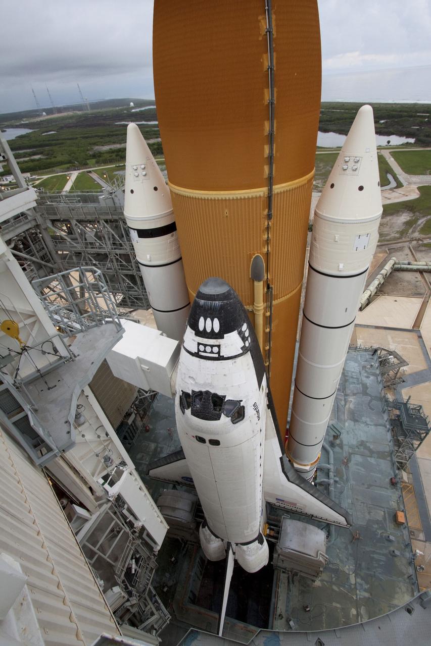 CAPE CANAVERAL, Fla. -- Space shuttle Atlantis is revealed on Launch Pad 39A at NASA's Kennedy Space Center in Florida following the move of the rotating service structure (RSS). The structure provides weather protection and access to the shuttle while it awaits liftoff on the pad. RSS "rollback" marks a major milestone in Atlantis' STS-135 mission countdown. Atlantis and its crew of four; Commander Chris Ferguson, Pilot Doug Hurley and Mission Specialists Sandy Magnus and Rex Walheim, are scheduled to lift off at 11:26 a.m. EDT on July 8 to deliver the Raffaello multi-purpose logistics module packed with supplies and spare parts to the International Space Station. Atlantis also will fly the Robotic Refueling Mission experiment that will investigate the potential for robotically refueling existing satellites in orbit. In addition, Atlantis will return with a failed ammonia pump module to help NASA better understand the failure mechanism and improve pump designs for future systems. STS-135 will be the 33rd flight of Atlantis, the 37th shuttle mission to the space station, and the 135th and final mission of NASA's Space Shuttle Program. For more information visit, www.nasa.gov/mission_pages/shuttle/shuttlemissions/sts135/index.html. Photo credit: NASA/Ken Thornsley