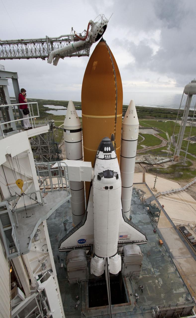 CAPE CANAVERAL, Fla. -- Space shuttle Atlantis is revealed on Launch Pad 39A at NASA's Kennedy Space Center in Florida following the move of the rotating service structure (RSS). The structure provides weather protection and access to the shuttle while it awaits liftoff on the pad. RSS "rollback" marks a major milestone in Atlantis' STS-135 mission countdown. Atlantis and its crew of four; Commander Chris Ferguson, Pilot Doug Hurley and Mission Specialists Sandy Magnus and Rex Walheim, are scheduled to lift off at 11:26 a.m. EDT on July 8 to deliver the Raffaello multi-purpose logistics module packed with supplies and spare parts to the International Space Station. Atlantis also will fly the Robotic Refueling Mission experiment that will investigate the potential for robotically refueling existing satellites in orbit. In addition, Atlantis will return with a failed ammonia pump module to help NASA better understand the failure mechanism and improve pump designs for future systems. STS-135 will be the 33rd flight of Atlantis, the 37th shuttle mission to the space station, and the 135th and final mission of NASA's Space Shuttle Program. For more information visit, www.nasa.gov/mission_pages/shuttle/shuttlemissions/sts135/index.html. Photo credit: NASA/Ken Thornsley