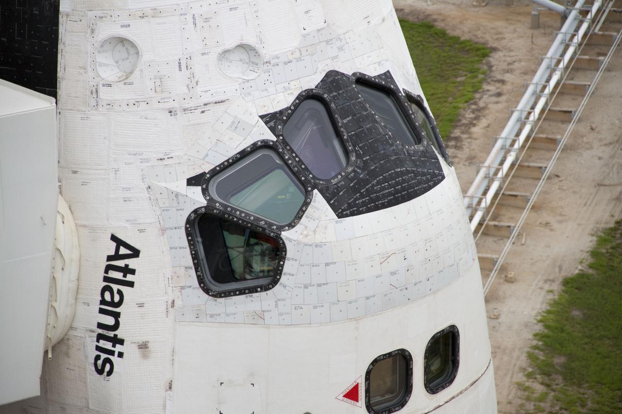 CAPE CANAVERAL, Fla. -- The crew compartment of space shuttle Atlantis is revealed on Launch Pad 39A at NASA's Kennedy Space Center in Florida following the move of the rotating service structure (RSS). The structure provides weather protection and access to the shuttle while it awaits liftoff on the pad. RSS "rollback" marks a major milestone in Atlantis' STS-135 mission countdown. Atlantis and its crew of four; Commander Chris Ferguson, Pilot Doug Hurley and Mission Specialists Sandy Magnus and Rex Walheim, are scheduled to lift off at 11:26 a.m. EDT on July 8 to deliver the Raffaello multi-purpose logistics module packed with supplies and spare parts to the International Space Station. Atlantis also will fly the Robotic Refueling Mission experiment that will investigate the potential for robotically refueling existing satellites in orbit. In addition, Atlantis will return with a failed ammonia pump module to help NASA better understand the failure mechanism and improve pump designs for future systems. STS-135 will be the 33rd flight of Atlantis, the 37th shuttle mission to the space station, and the 135th and final mission of NASA's Space Shuttle Program. For more information visit, www.nasa.gov/mission_pages/shuttle/shuttlemissions/sts135/index.html. Photo credit: NASA/Ken Thornsley