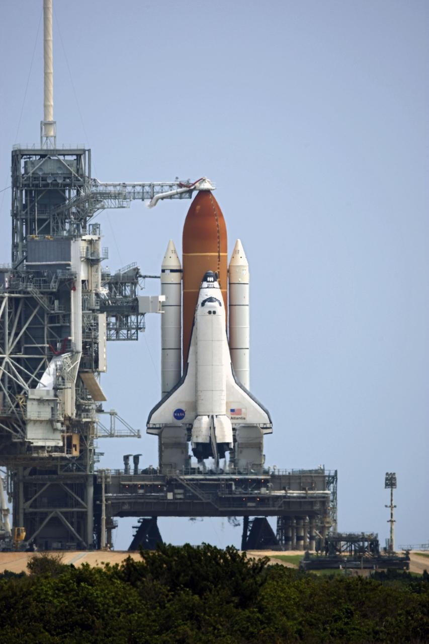 CAPE CANAVERAL, Fla. -- Space shuttle Atlantis awaits liftoff from Launch Pad 39A at NASA's Kennedy Space Center in Florida on its STS-135 mission to the International Space Station. Atlantis with its crew of four; Commander Chris Ferguson, Pilot Doug Hurley, Mission Specialists Sandy Magnus and Rex Walheim, lifted off at 11:29 a.m. EDT on July 8, 2011 to deliver the Raffaello multi-purpose logistics module packed with supplies and spare parts for the International Space Station. Atlantis also will fly the Robotic Refueling Mission experiment that will investigate the potential for robotically refueling existing satellites in orbit. In addition, Atlantis will return with a failed ammonia pump module to help NASA better understand the failure mechanism and improve pump designs for future systems. STS-135 is the 33rd flight of Atlantis, the 37th shuttle mission to the space station, and the 135th and final mission of NASA's Space Shuttle Program. For more information, visit www.nasa.gov/mission_pages/shuttle/shuttlemissions/sts135/index.html. Photo credit: NASA/Kenny Allen